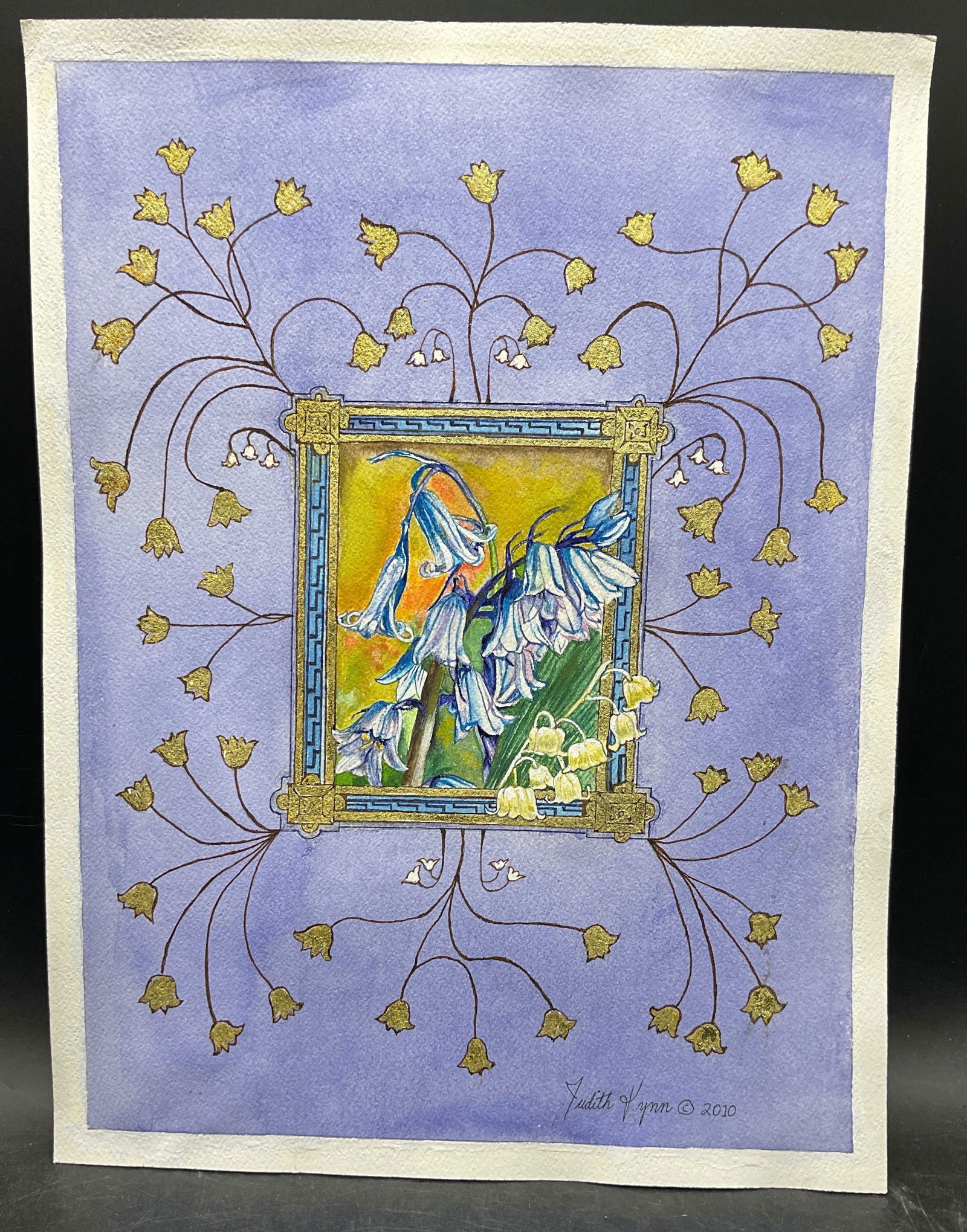 Judith Lynn Bluebells Gold Watercolor Painting: Watercolor painting with 18k Gold Leaf on paper. Signed Judith Lynn. Bluebells and Lily of the Valley. Measures approx. 16 x 12 inches. some wear consistent with exposure. Property of opera singers es