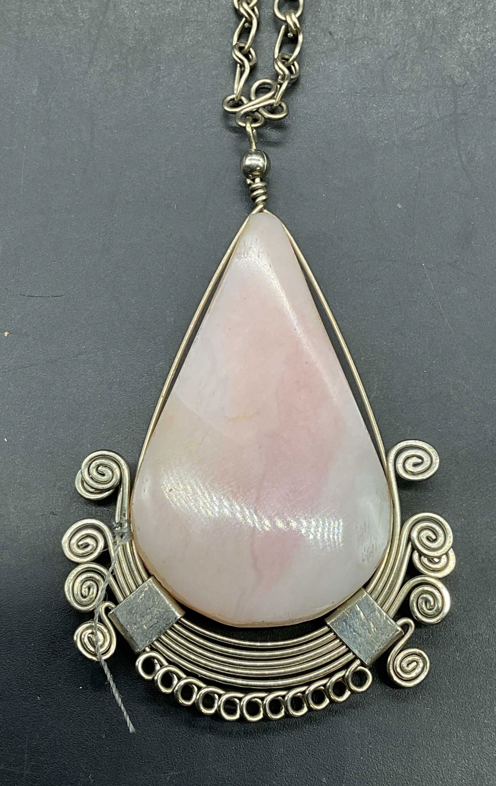 Vintage Silver Tone Pink Semiprecious Necklace: Vintage silver tone filigree pendant necklace with pink semiprecious stone. Drop length approx 9 inches. Some scratching. Jewelry, estate jewelry, costume jewelry, cocktail jewelry, fashion jewelry, a