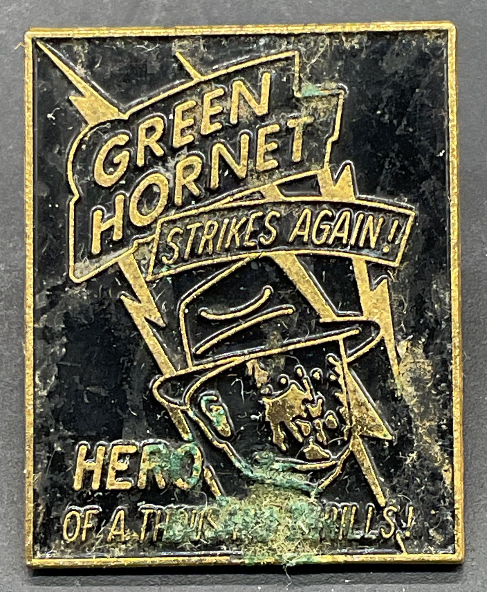 Vintage Gold Tn Green Hornet Enamel Pin: Vintage gold tone black enamel Green Hornet enamel pin. Measures approx. 1.25 x 1 inches. Some residue and scratching. Jewelry, estate jewelry, costume jewelry, cocktail jewelry, fashion jewelry, acce