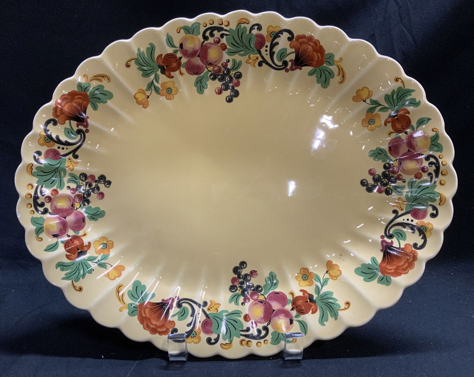 Vtg Trojan By Sebring Wild Fruit Ceramic Platter: Vintage ceramic oval platter features a yellow glaze with fruit motifs. Signed & marked on underside. Reads, TROJAN BY SEBRING USA. WILD FRUIT DARK YELLOW GLAZE. Surface wear consistent to age, use &