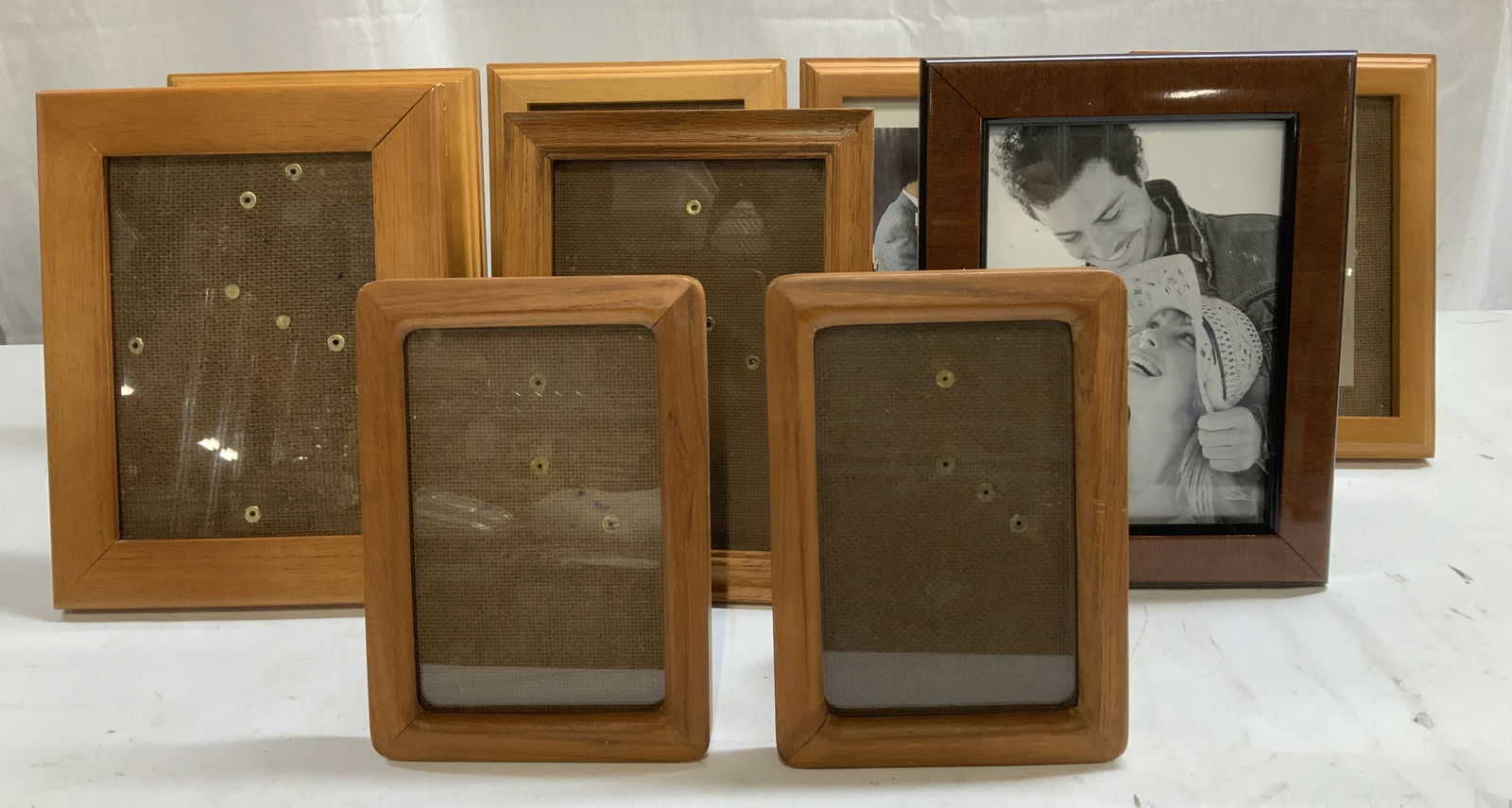 Lot 9 Assorted Wooden Frames HERITAGE+: Lot includes, 9 assorted wooden frames. Vary in size & brand. Dark toned. Signed & marked. Reads, HERITAGE COLLECTION, FETCO INTERNATIONAL, MALDEN. Surface wear consistent to age, use & exposure. Meas