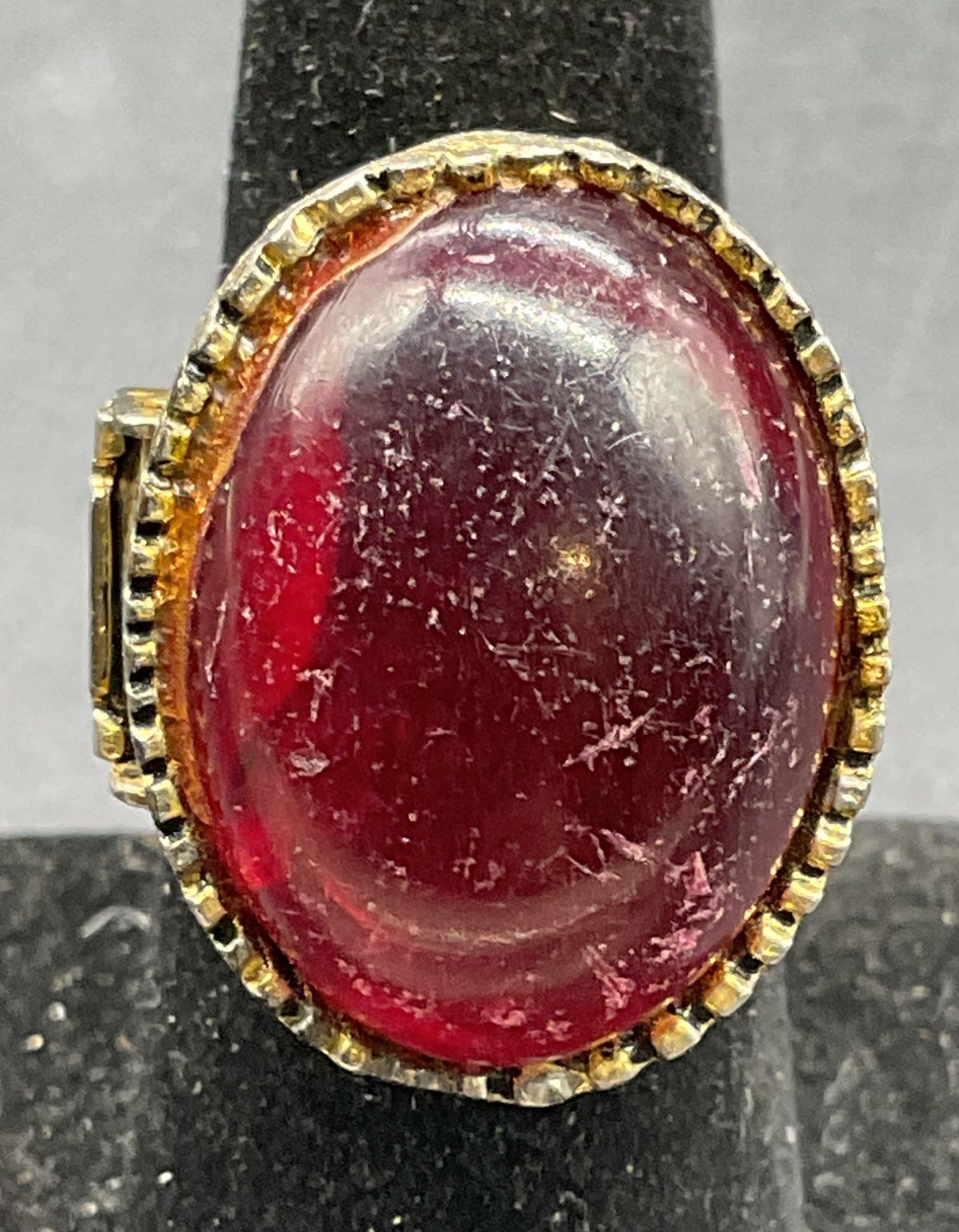 Vintage Gold Tone Red Lucite Pill Box Ring: Vintage gold and silver tone adjustable band pill box ring with red lucite cabochon. Some scratching and warping. Jewelry, estate jewelry, costume jewelry, cocktail jewelry, fashion jewelry,