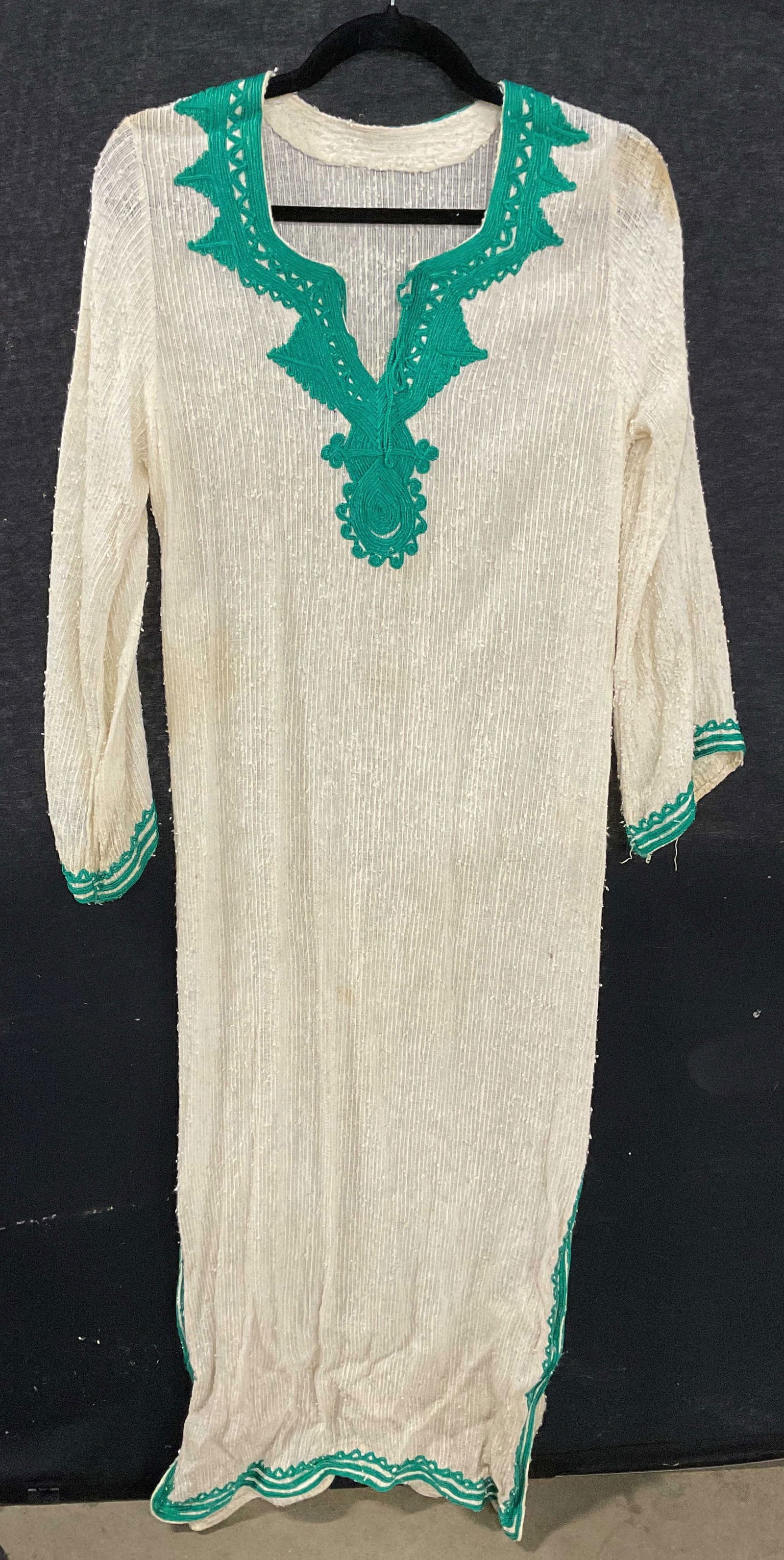 Vintage White Embroidered Green Maxi Dress: Vintage ribbed white long sleeve maxi dress with green embroidered trim. Possibly cotton or wool. Measures approx 16 inches across chest. Wear including blemishes, pulling, and pilling. Maxi