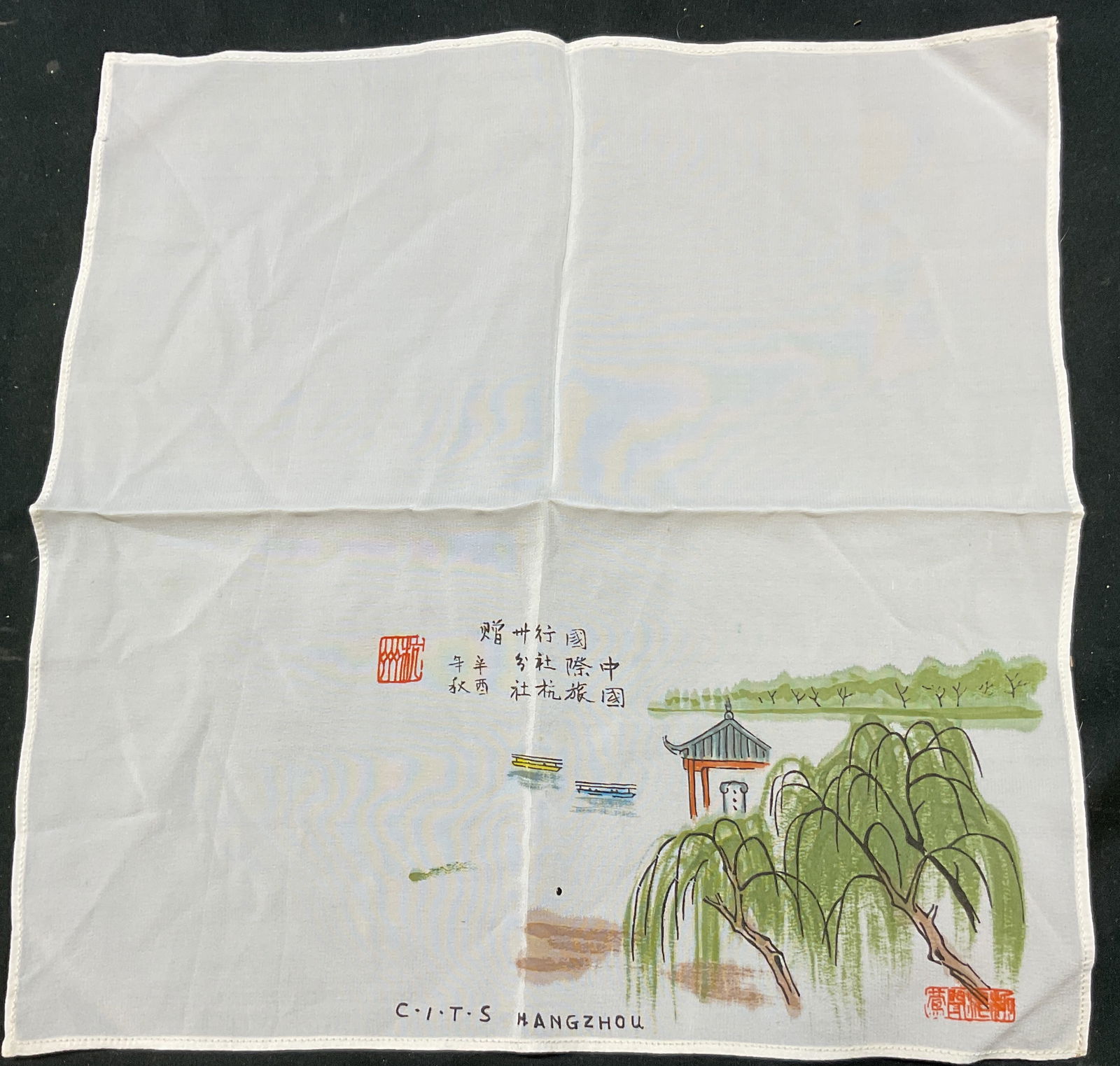Vintage Chinese CITS Hangzhou Silk Handkerchief: Vintage Chinese CITS Hangzhou silk handkerchief. Silk material. Reads CITS Hangzhou. Chinese characters. Motifs of trees, water, boats, and architecture. Measures approx 11 x 11 inches. Wear consisten