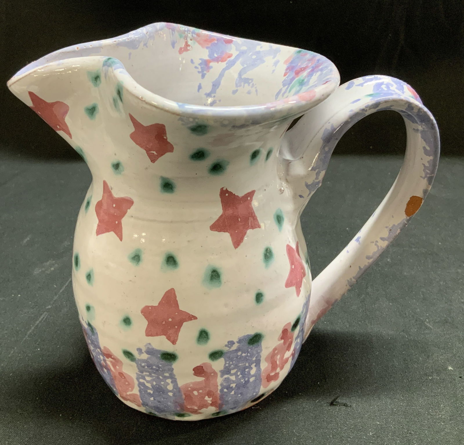 Sgnd Hand Painted Star Motif Creamer: Appears to be possible Susan Leader. Creamer features hand painted star & dot motifs. Shades of pink, purple, white, green. Ceramic material. Signed & marked on underside. Surface wear consistent to a