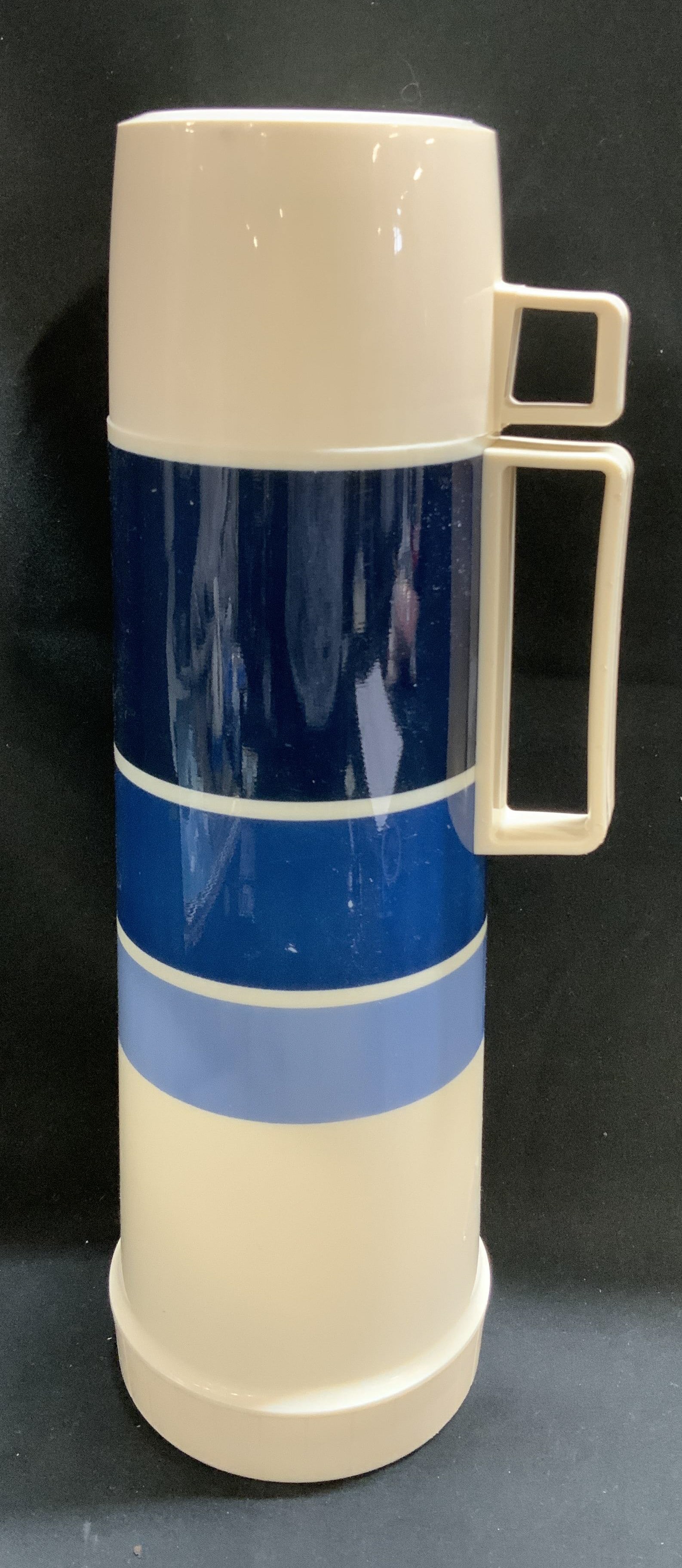 Vntg King Seeley Blue Striped Thermo: Vintage King-Seeley thermo features a cream colored body & blue striped pattern. 10oz. Signed & marked. Reads, THERMOS. A HOUSEHOLD INTERNATIONAL COMPANY. Surface wear consistent to age, use & exposur