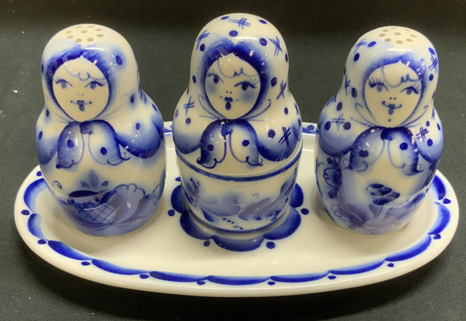 Sgnd Vtg Salt & Pepper Condiment Set W Tray: Lot includes, salt & pepper shakers with a condiment jar. Comes with matching tray. Pieces depict nesting style doll figures with folk art motifs. Blue & white toned. Signed & marked on underside. Sur