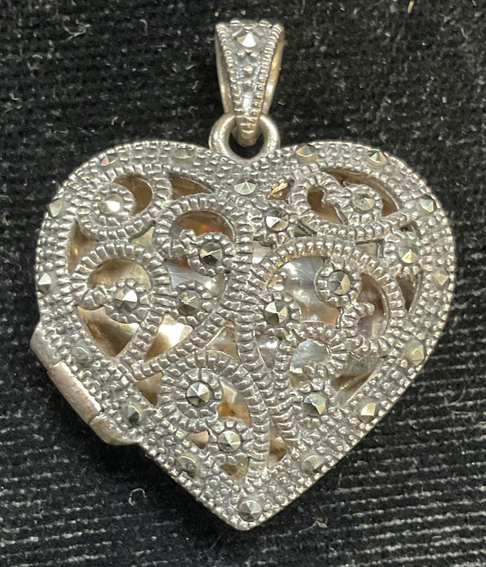 SLC Sterling Silver Marcasite Heart Locket: Signed SLC Sterling silver filigree heart locket pendant with marcasite. Marked sterling. Measures approx 1 x 1 inches. Total weight 7.9 grams. Some scratching. Jewelry, estate jewelry, fine jewelry,