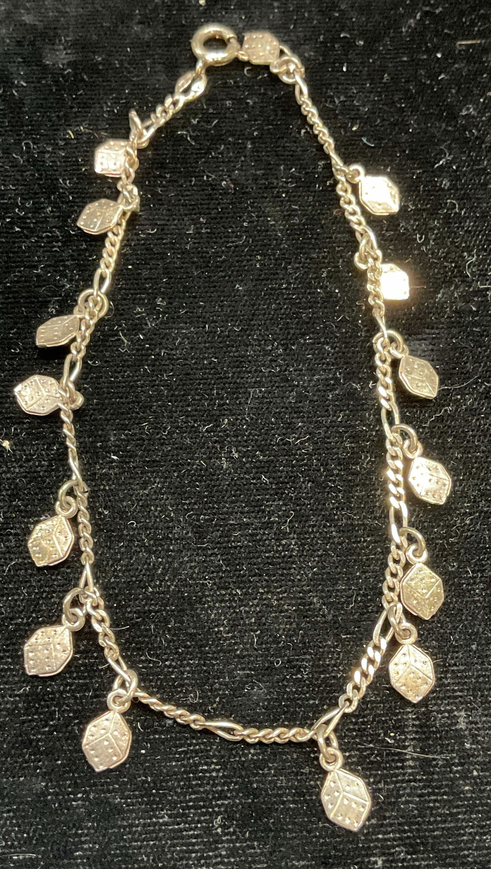Vintage Sgn Sterling Silver Dice Charm Bracelet: Vintage signed AT sterling silver bracelet with dice motif charm pendants. Marked sterling. Measures approx 9 inches long. Total weight 6.8 grams. Some scratching. Jewelry, estate jewelry, fine
