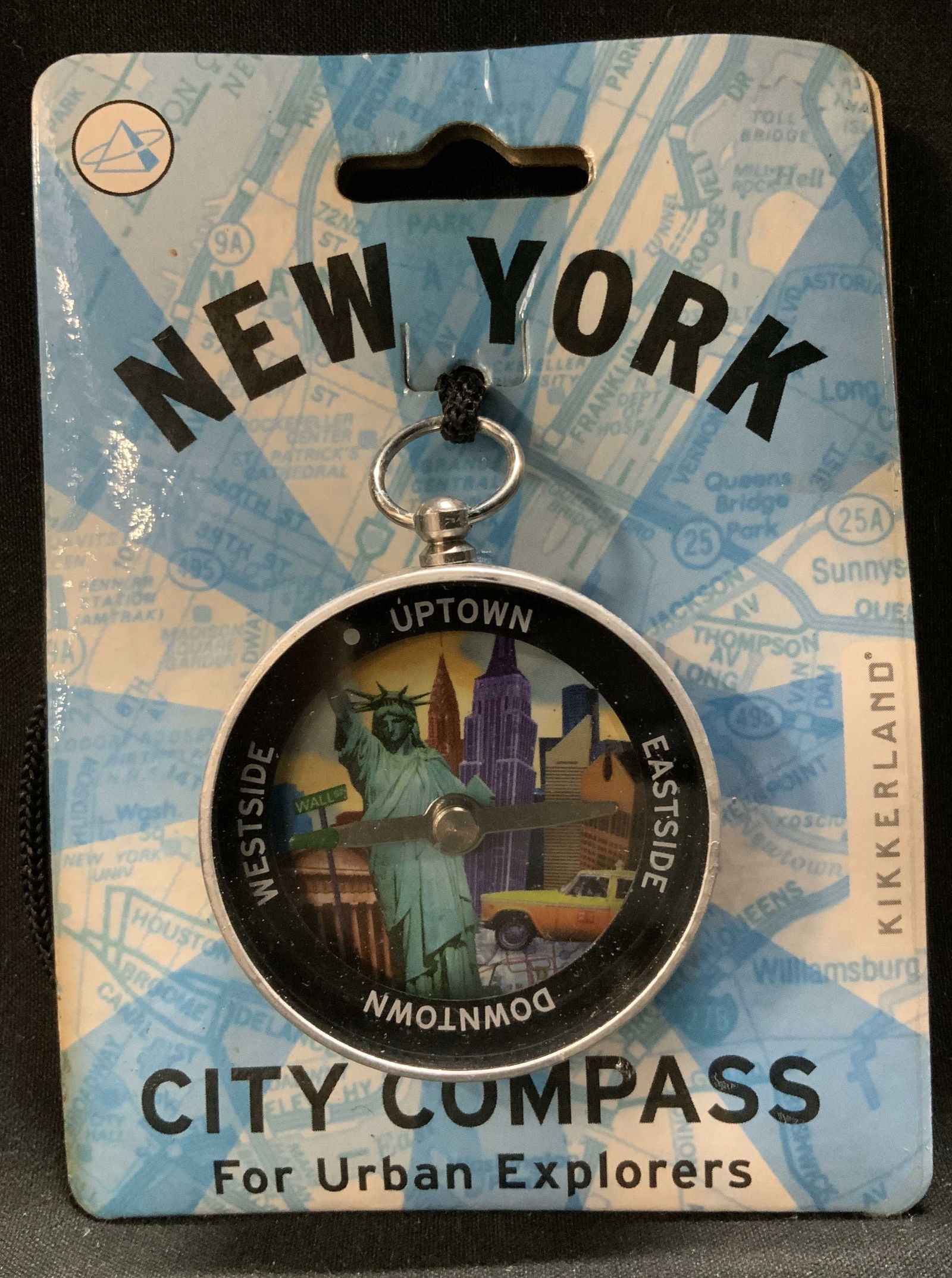2001 New York City Compass Urban Explorers: New York City Compass for Urban Explorers. Artwork by Victoria Kann. Copyright 2001. Compass features an illustration of the Statue of Liberty & west side, uptown, downtown & eastside. Sold as is. Sur