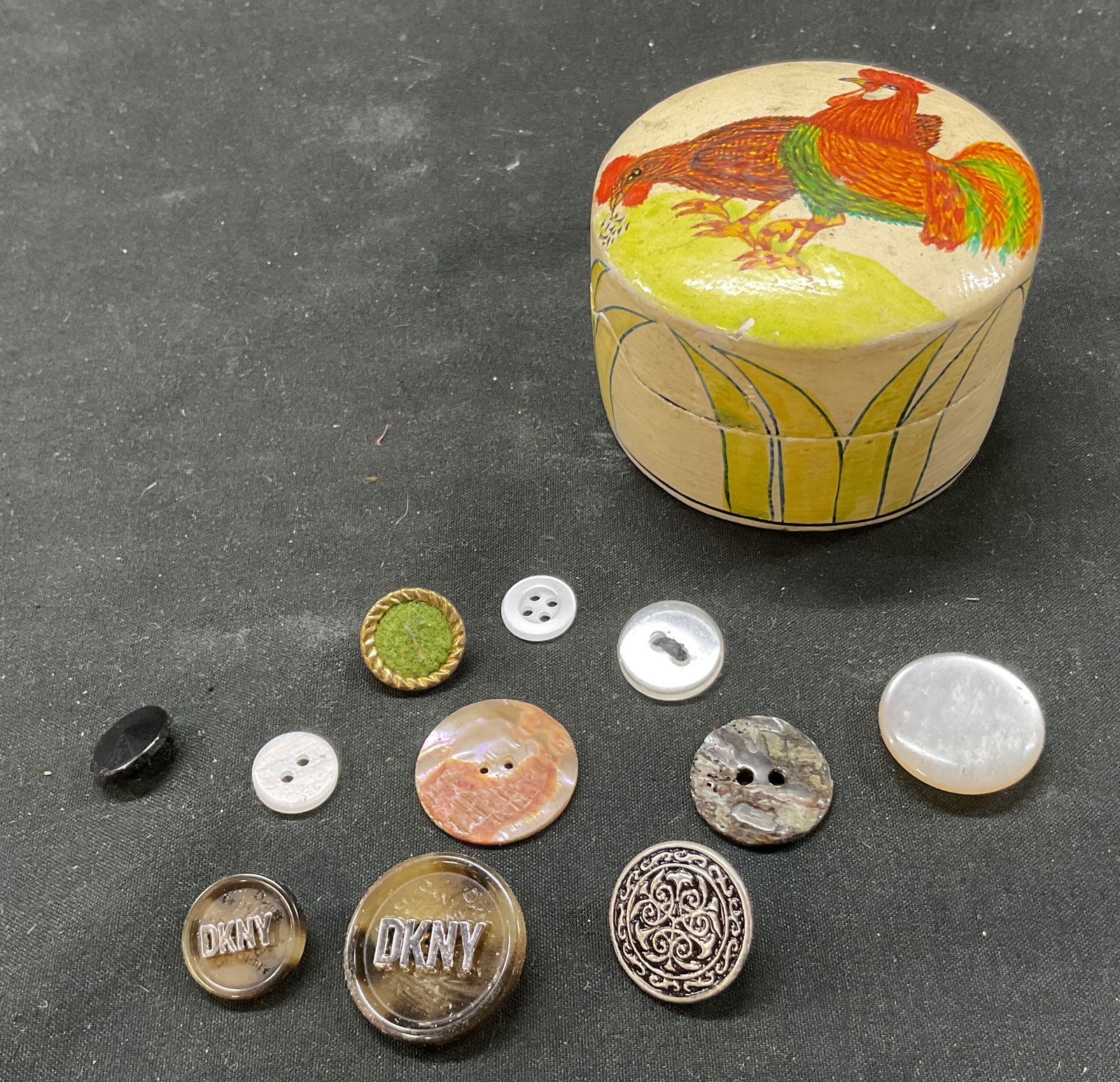 Grp Lot 12 Lacquer Trinket Box & Button Collection: Group lot of 12 items. Includes small round hand painted lacquer lidded trinket box. Marked on underside, as photographed here. Rooster and floral motifs. Lot also includes assortment of buttons. Vary