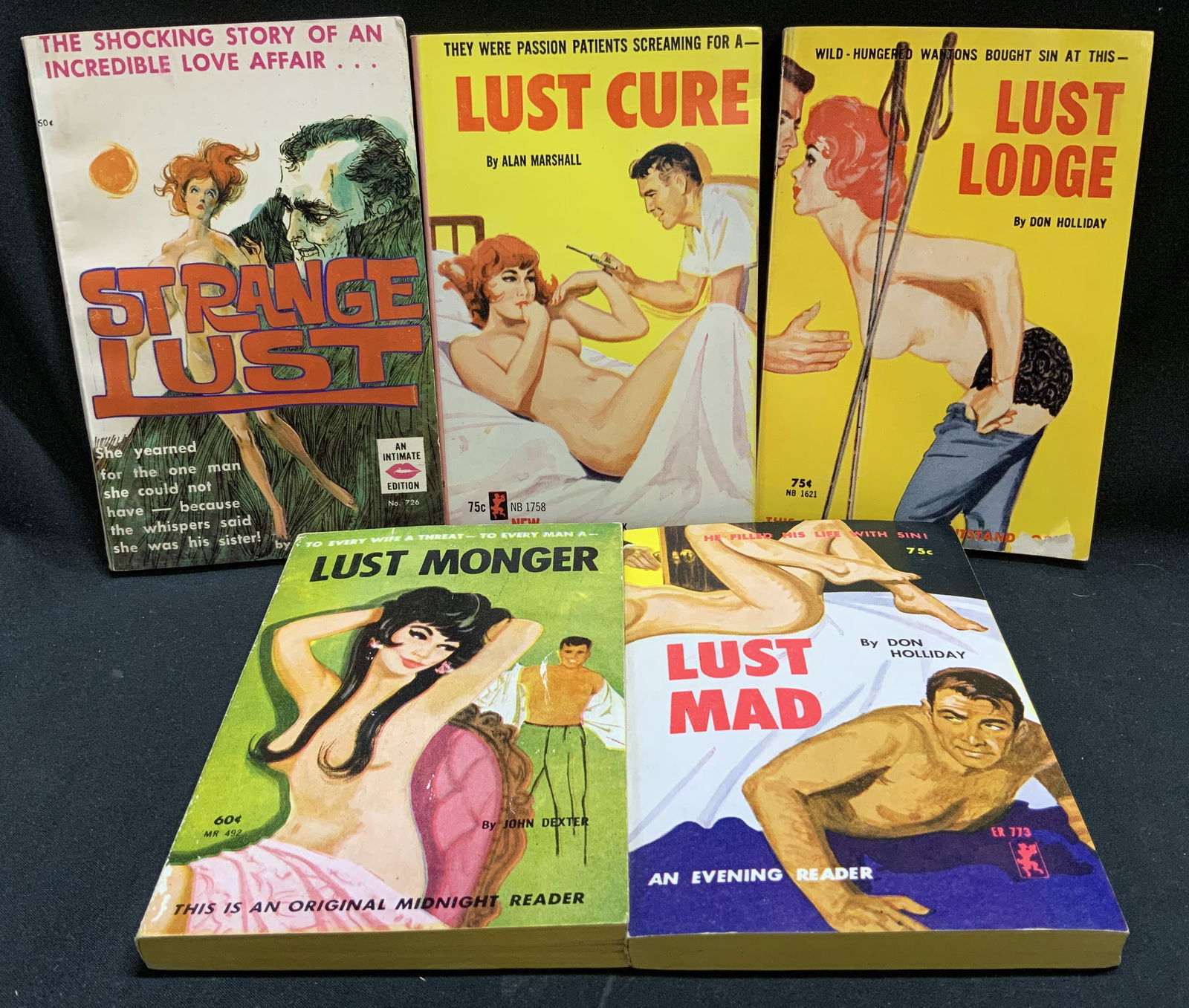 Lot 5 Pulp Fiction Erotica 1960s Bks HOLLIDAY: Lot includes, Strange Lust by Donald G. McGregor (first printing 1963), Lust Cure by Alan Marshall (1965), Lust Lodge by Don Holliday (1962), Lust Monger by John Dexter (1963), Lust Mad by Don Hollida