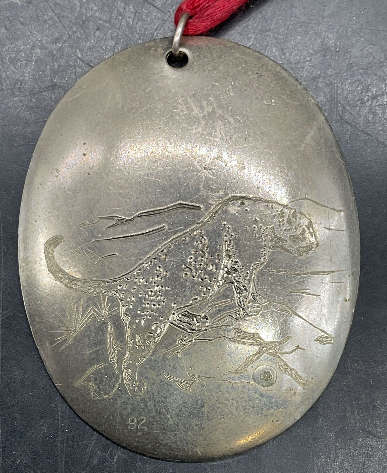 Ortiz Design Mountain Lion Pendant Santa Fe NM: Vintage signed Ortiz Design Santa Fe New Mexico silver tone etched mountain lion pendant. Measures approx. 2.5 x 2 inches. Some scratching. Property of opera singers estate from the renowned and