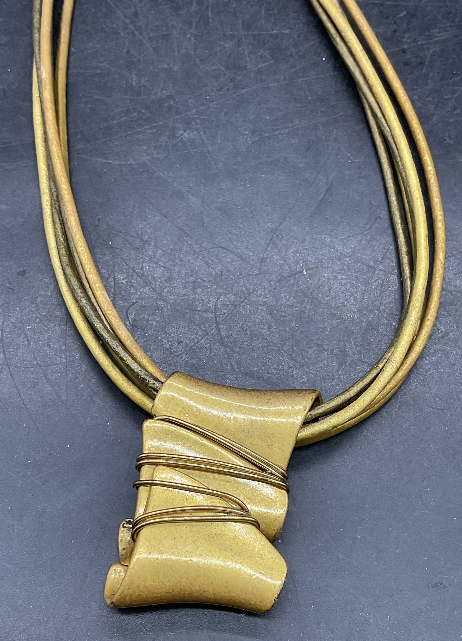 Vintage Chicos Gold Tone Pendant Necklace: Vintage signed Chicos gold tone pendant necklace on multi strand gold tone cords. Drop length approx 8.5 inches. Some scratching. Jewelry, estate jewelry, costume jewelry, cocktail jewelry,