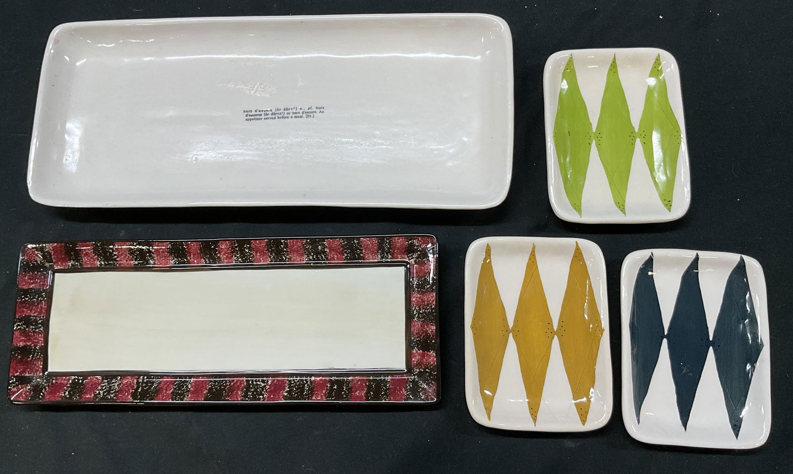 Lot 5 Magenta, Warren Kimble Ceramic Tableware: Lot of 5 items. Three Magenta ceramic hand painted trinket dishes. Marked on underside, reads Rae Dunn By Magenta. Hand painted geometric pattern in varying colors. Magenta ceramic serving tray.