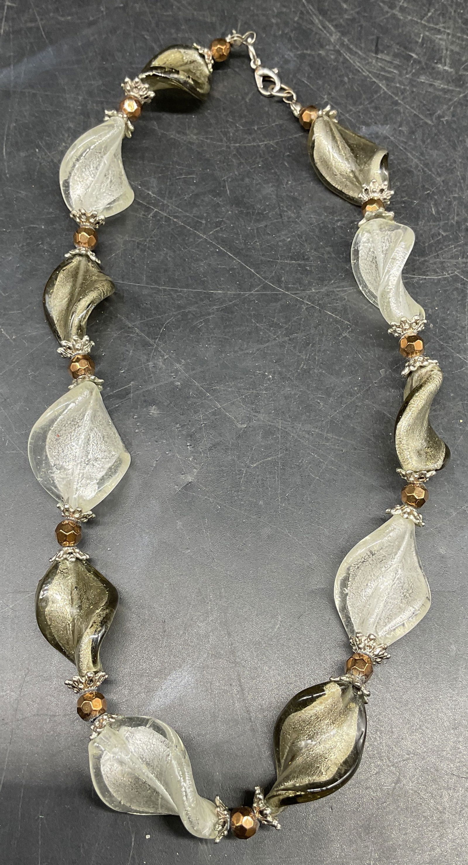 Vintage White Art Glass Twisted Necklace: Vintage Murano style art glass necklace with white and silver metallic twisted beads. Drop length approx 8 inches. Some scratching. Jewelry, estate jewelry, costume jewelry, cocktail jewelry, fashion