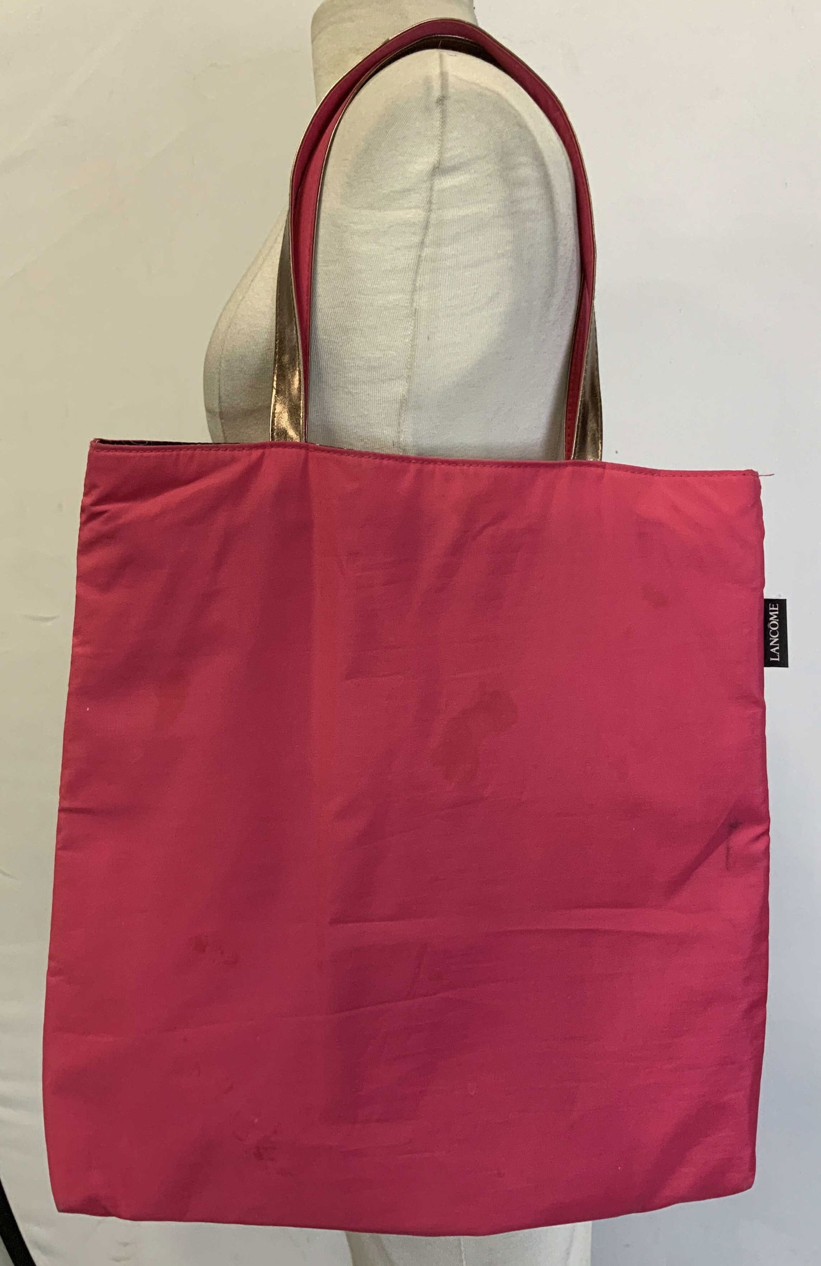 Lancome Hot Pink Reversible Tote Bag: Lancome reversible tote bag features a hot pink finish & colorful macaron design. Feels like polyester or synthetic material. Property of Upper East Side French stage and screen actors estate,