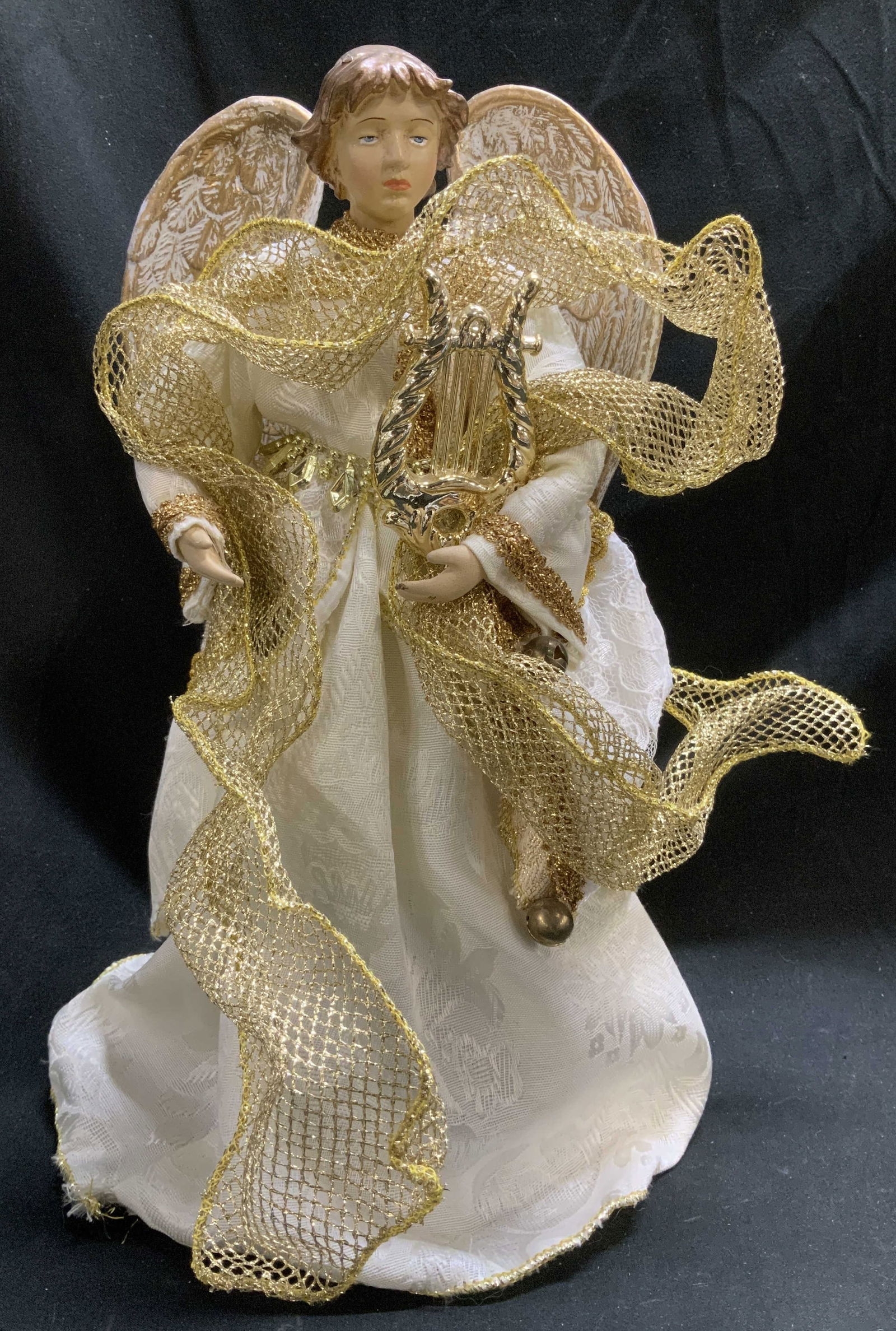 Vtg Gold Christmas Angel Tree Topper: Vintage Christmas tree topper shaped like an angel wearing a gown & is holding a golden harp. Composite material. Property of opera singers estate from the renowned & opulent Manhattan landmark. The A