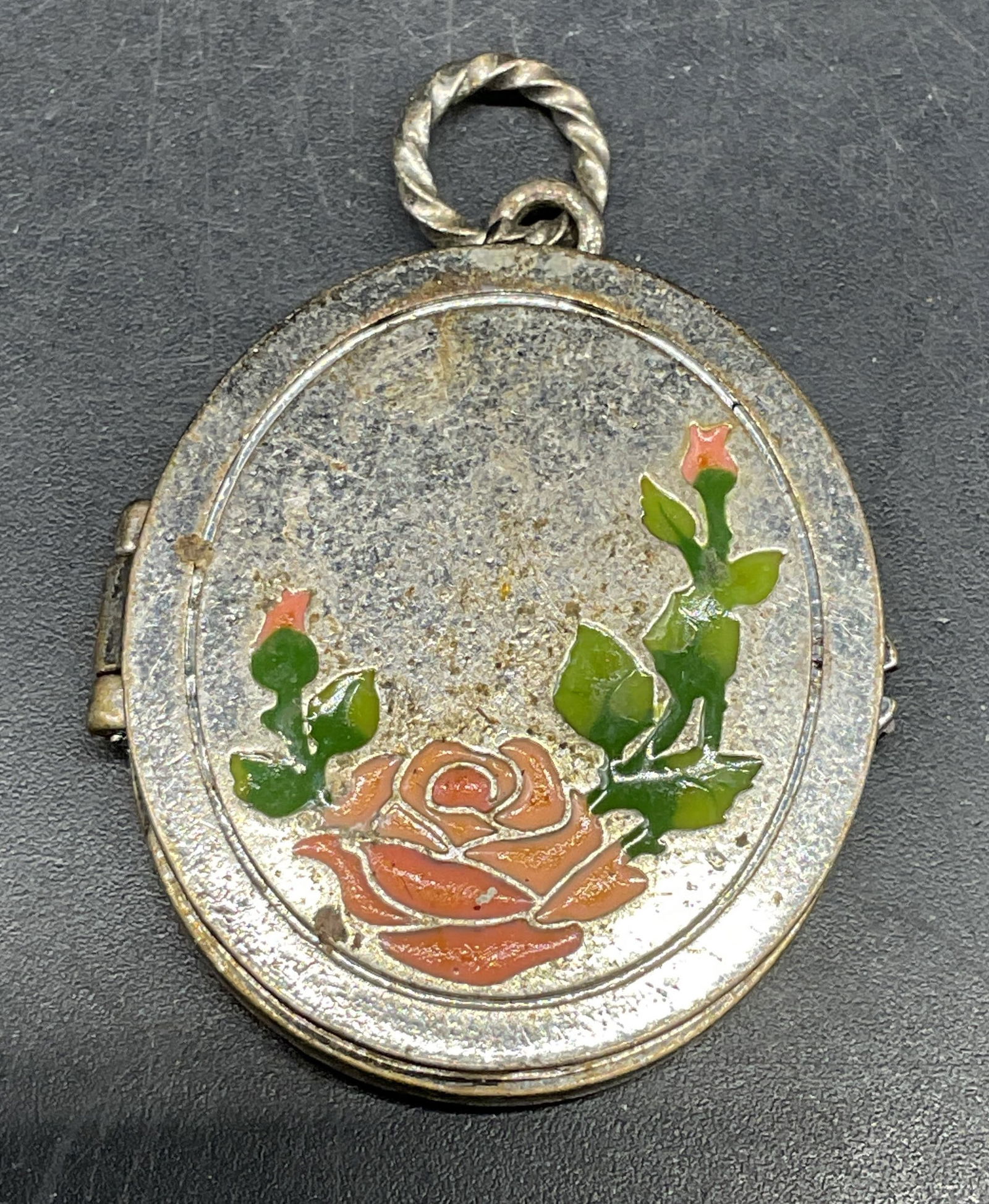 Vintage Silver Tone Enamel Flower Locket: Vintage silver tone enameled flower locket. Measures approx. 1.25 x 1 1/8 inches. Some scratching. Jewelry, estate jewelry, costume jewelry, cocktail jewelry, fashion jewelry, accessories, fashion acc