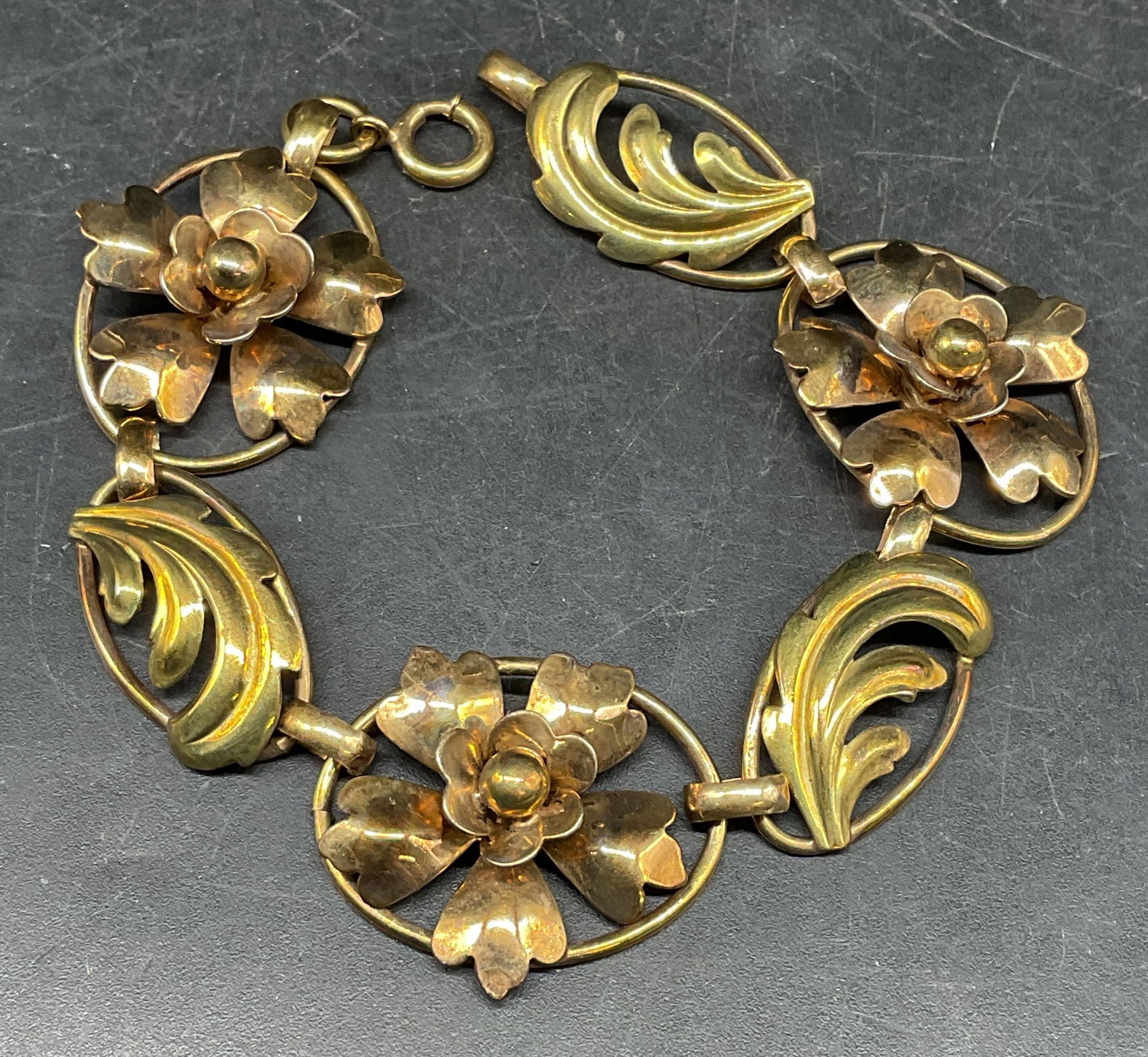 Vintage Sgn 12k Gold Filled Floral Bracelet: Vintage 12k gold filled floral panel bracelet. Signed illegibly. Measures approx. 6.5 inches long. Some scratching. Jewelry, estate jewelry, costume jewelry, cocktail jewelry, fashion jewelry, accesso