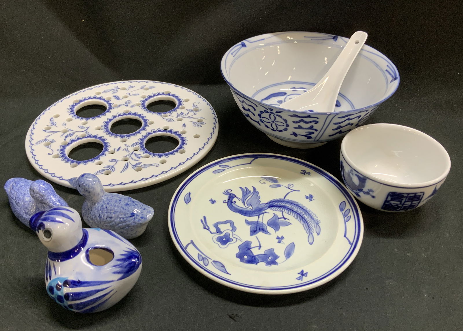 Lot 8 Blue & White Duck Figs & Tableware 1983+: Lot includes, 1 hand painted bird plate, 1 blue & white floral bulb top, 2 small & large porcelain bowls, 1 koi fish soup spoon, 3 duck figurines. Signed & marked on underside. Reads, Goedewaagen GOUD