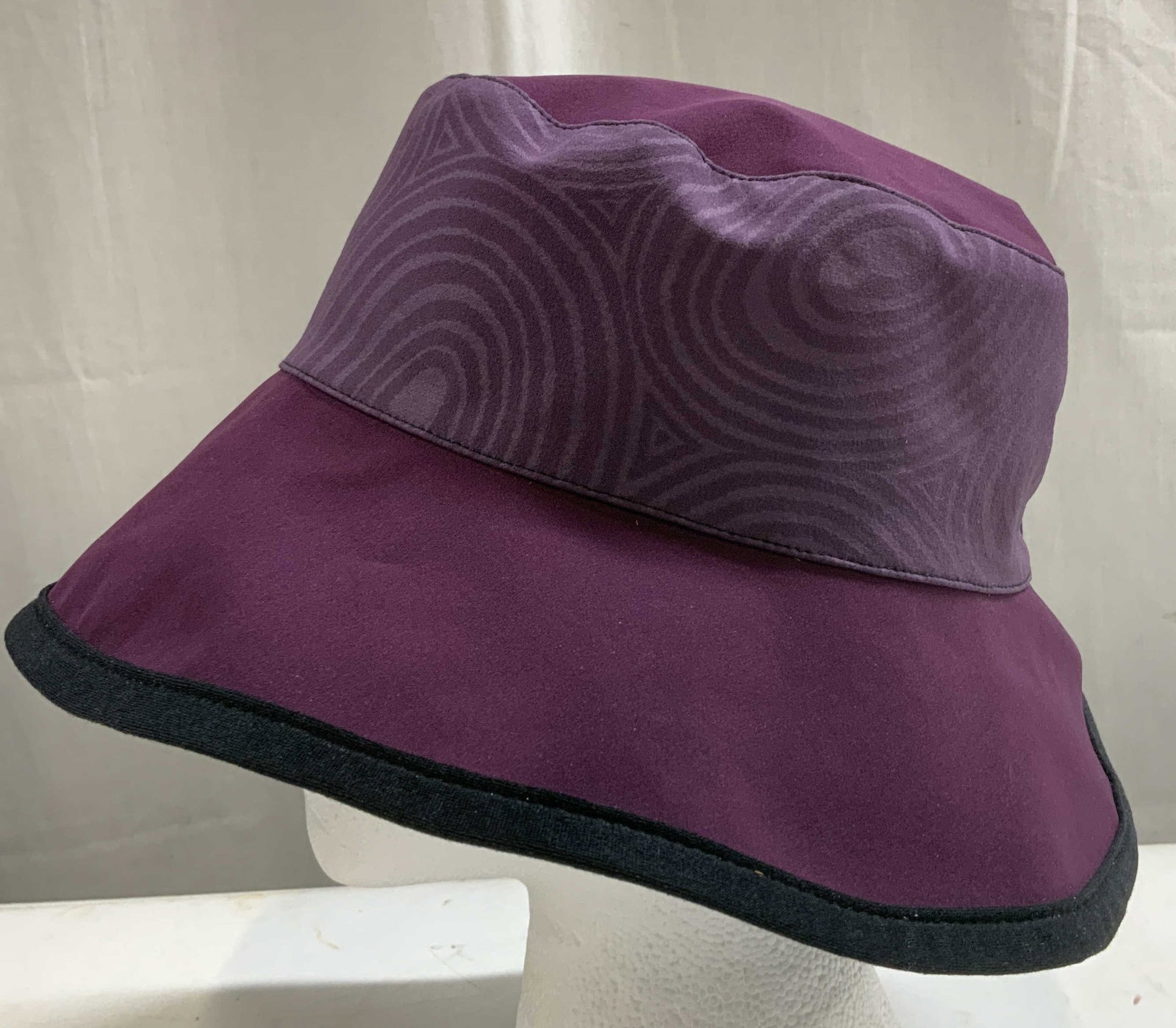 Vtg Purple & Black Bucket Hat: Vintage bucket hat is purple & black toned. Wide brim. Feels like synthetic material. Sold as is. Surface wear consistent to age, use & exposure. Measurements: Length 8.2in x width 8in. Purple & black
