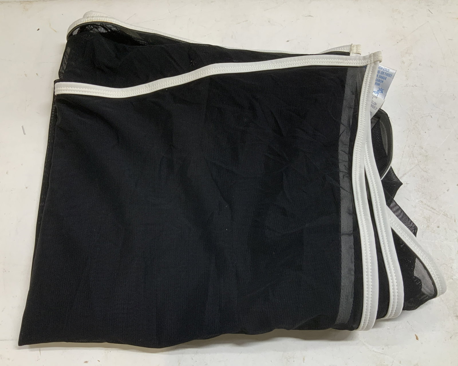 Baja Blue Swim Black Cover Up USA: Baja Blue mesh cover-up is black & white toned. White edges. 80% nylon & 20% spandex. One Size. Signed & marked. Reads, BAJA BLUE SWIM. MADE IN USA. Surface wear consistent to age, use & exposure. Mea