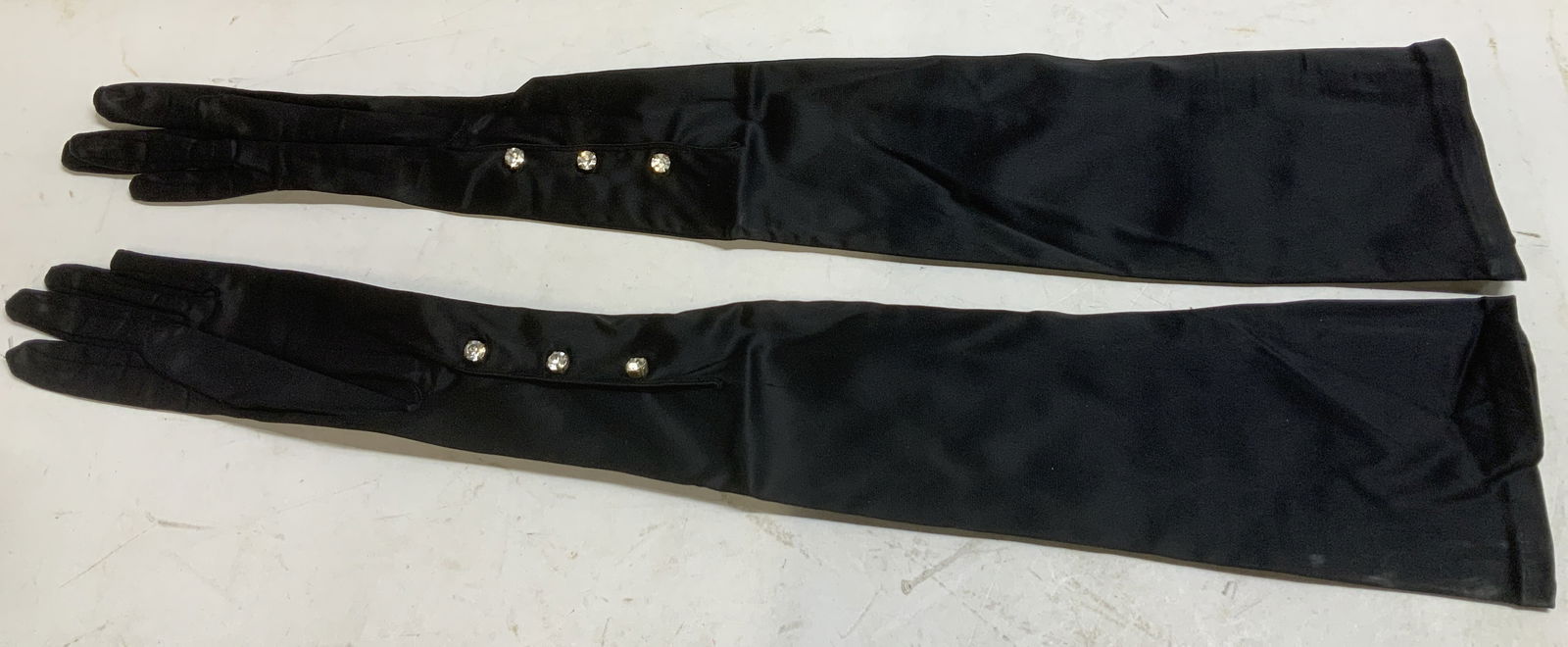 Vntg Long Black Opera Gloves: Lot includes, long opera gloves featuring embellishments button details. Property of Upper East Side French stage and screen actors estate, Manhattan. Surface wear consistent to age, use &