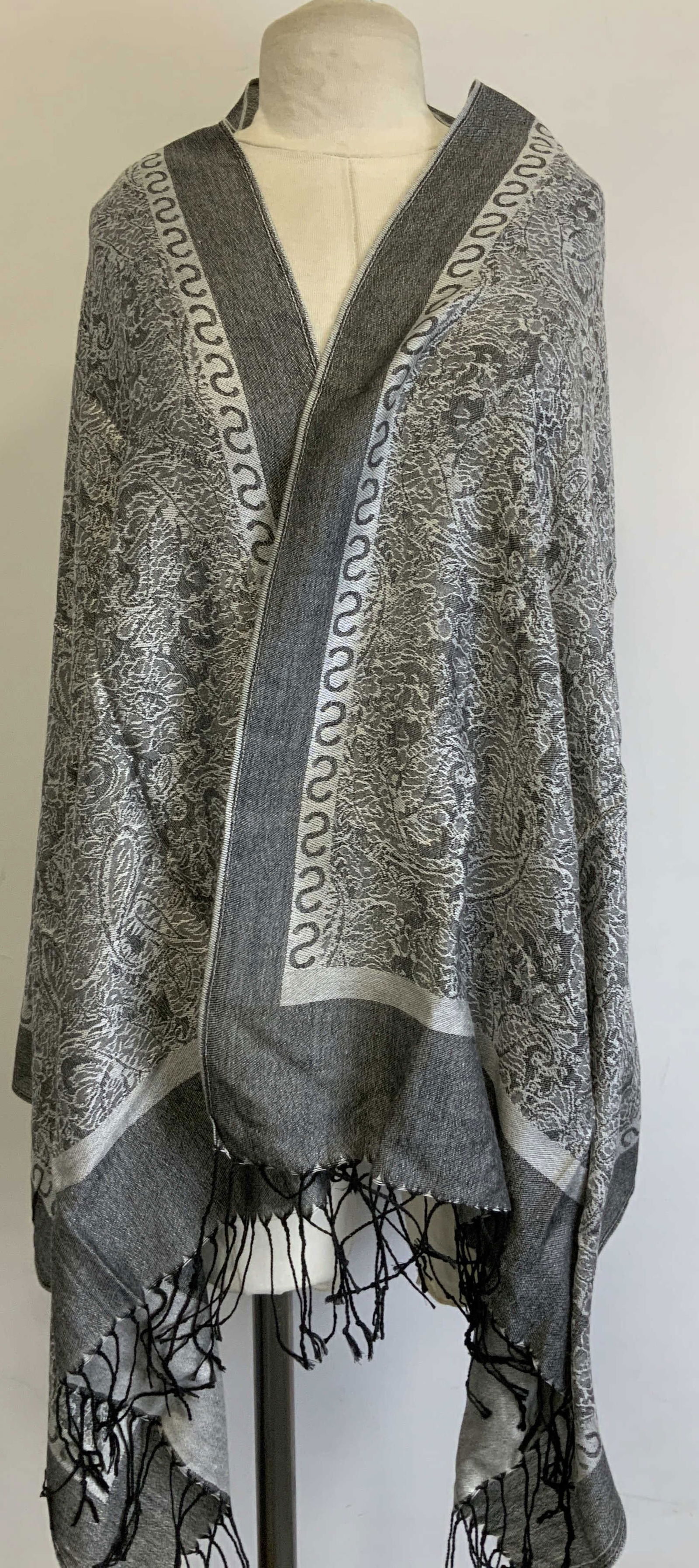 Vtg Grey & Black Paisley Fringed Shawl: Vintage shawl features a paisley pattern. Grey & black toned. Fringed ends. Surface wear consistent to age, use & exposure. Property of opera singers 55% acrylic & 45% viscose. estate from the