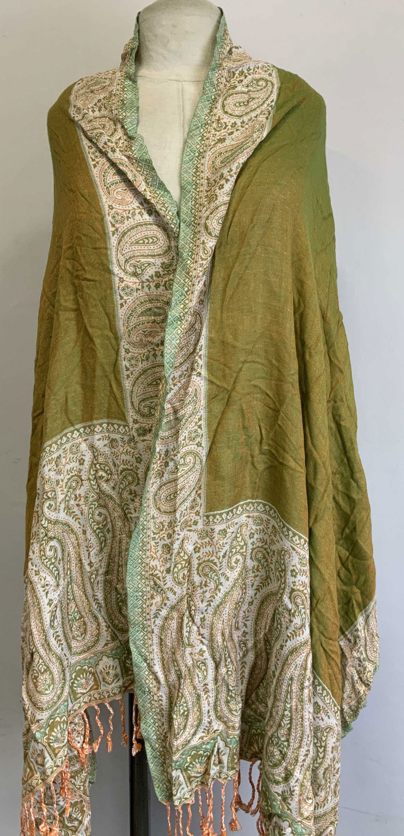 Vtg Green & Orange Paisley Fringed Shawl: Vintage shawl features a paisley pattern & fringed ends. Orange & green toned. Appears to be synthetic material. Surface wear consistent to age, use & exposure. Measurements: length 73in x width