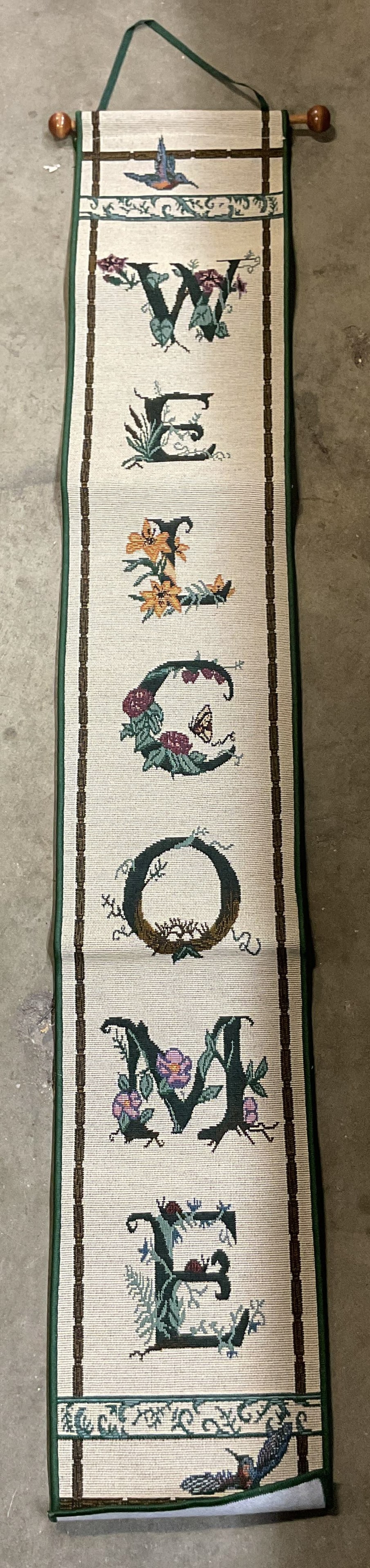Vintage Welcome Hummingbird Bell Pull USA 41in: Vintage Welcome Hummingbird Bell Pull. Made in USA. Cotton material. Wooden rod. Green trim. Reads Welcome with floral and hummingbird motifs. Varying colors. Measurements reads on tag 6.75 in by
