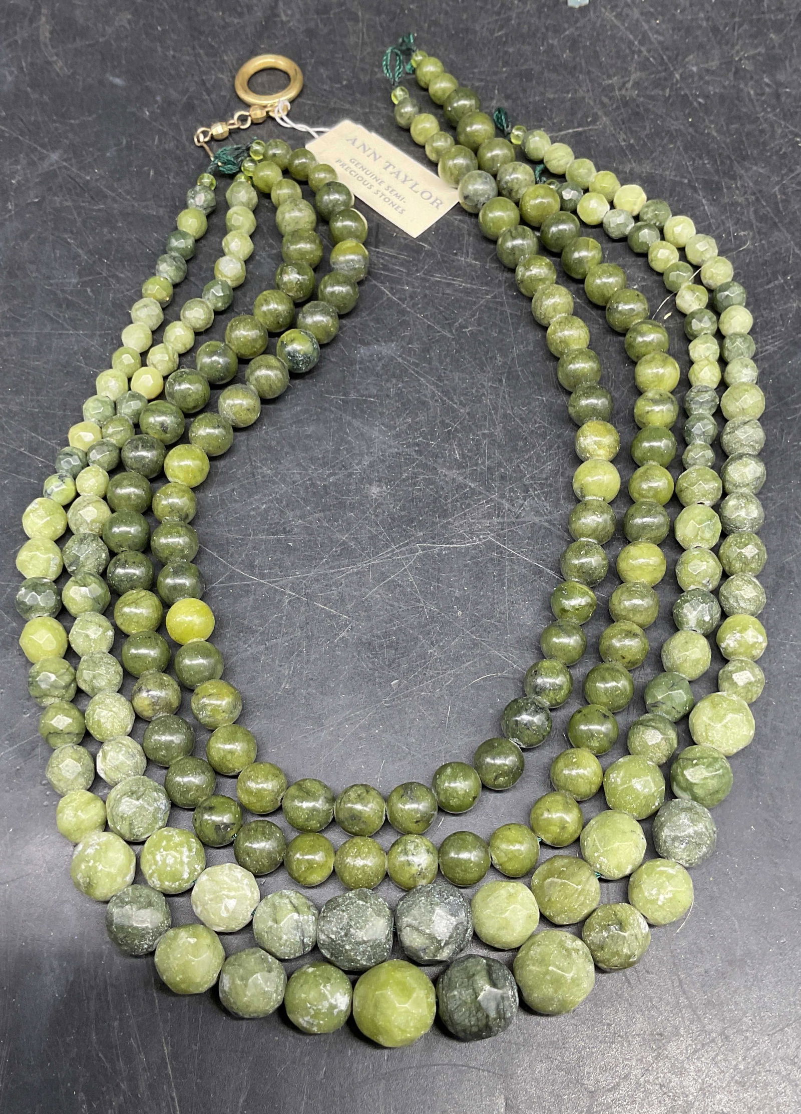 Ann Taylor Green Semiprecious Necklace NWT: Ann Taylor 4 strand green semiprecious stone beaded necklace. New with tag. Longest strand approx 17 inches long. Needs repair. Some scratching. Jewelry, estate jewelry, fine jewelry, cocktail
