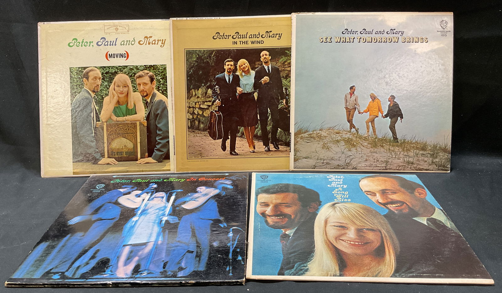 Lot 5 1960s Peter Paul & Mary Vinyl Records USA: Lot of 5 vinyl records. Records by Peter Paul and Mary. Made in USA. Titles include Moving, In The Wind, See What Tomorrow Brings, In Concert, and A Song Will Rise. Manufactured by Warner Bros, around