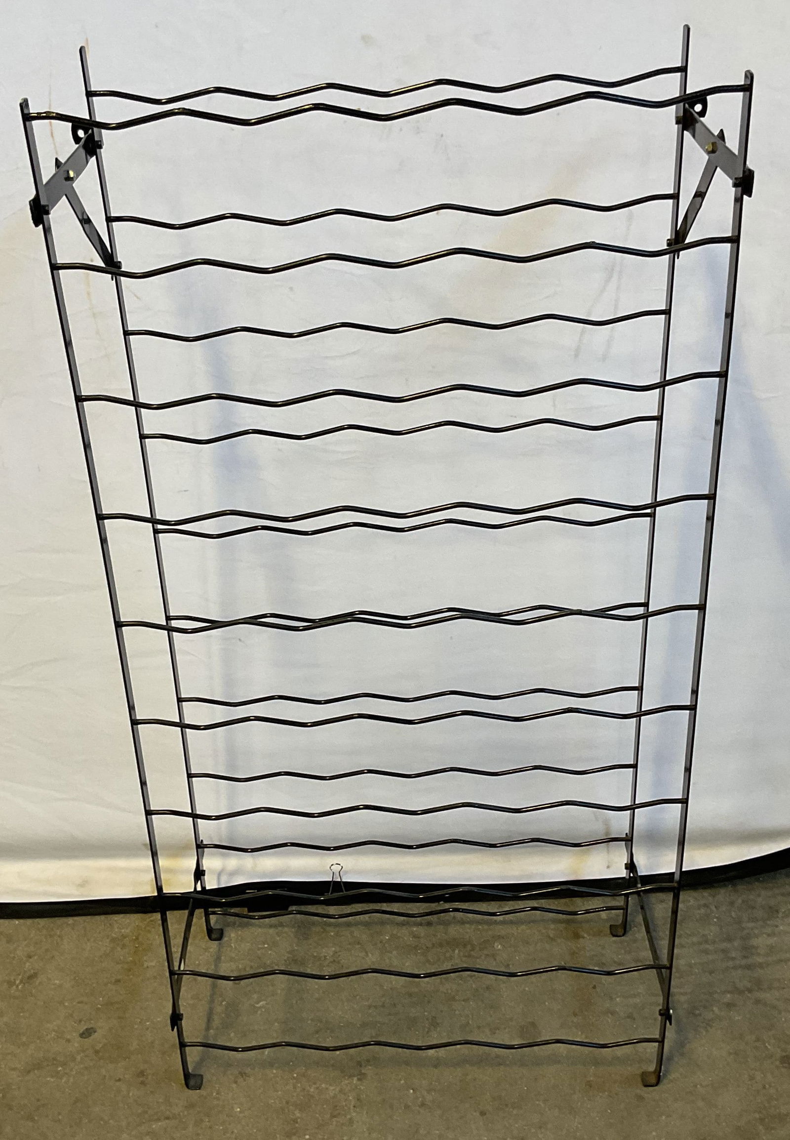 Black Metal Wire Wine Rack 40in: Black metal wire wine rack. Wall mountable. Measures approx. 19.75 x 9 x 40 inches. Some scratching. Wine rack, wall wine rack, black wine rack, metal wine rack, furniture, home decor, home