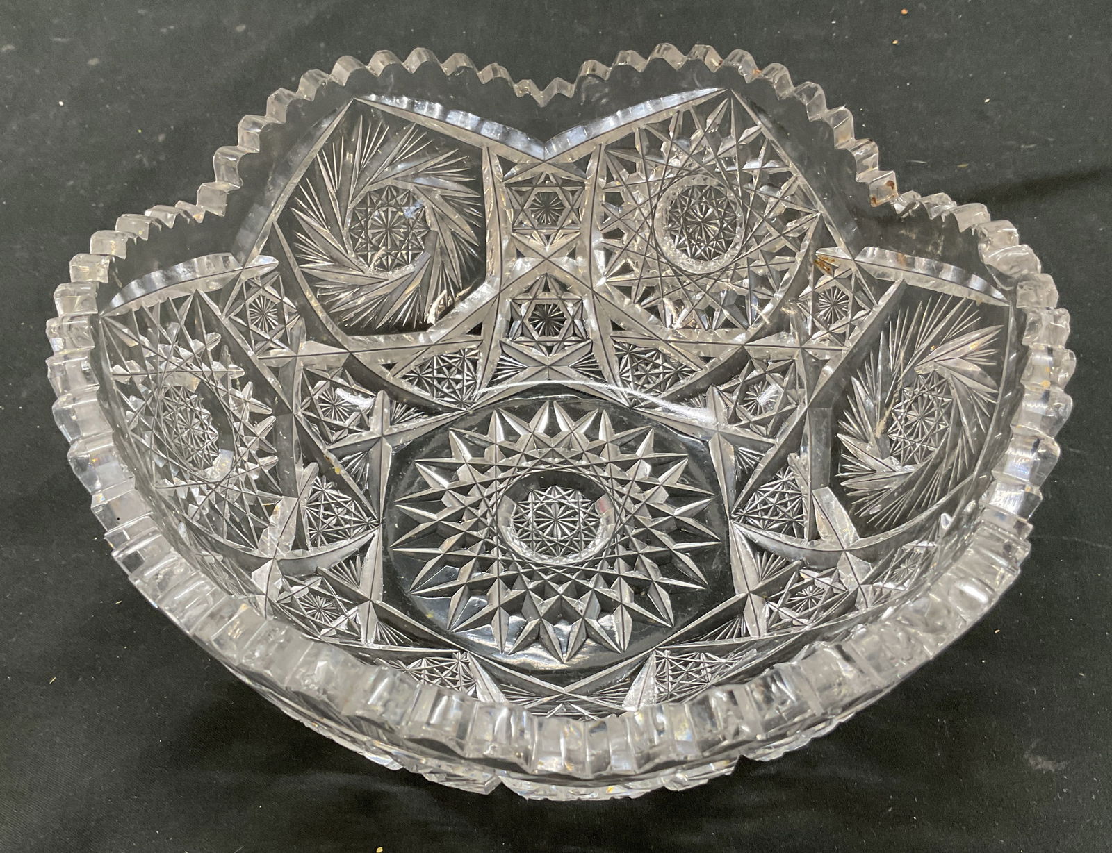 Vintage ABP Cut Crystal Decorative Bowl: Vintage American Brilliant Period cut crystal decorative bowl. Scalloped rim. Cut floral, pinwheel, hobstars, fans, and diamond motifs. Measures ht approx 3.5 inches diam approx 8.5 inches. Some