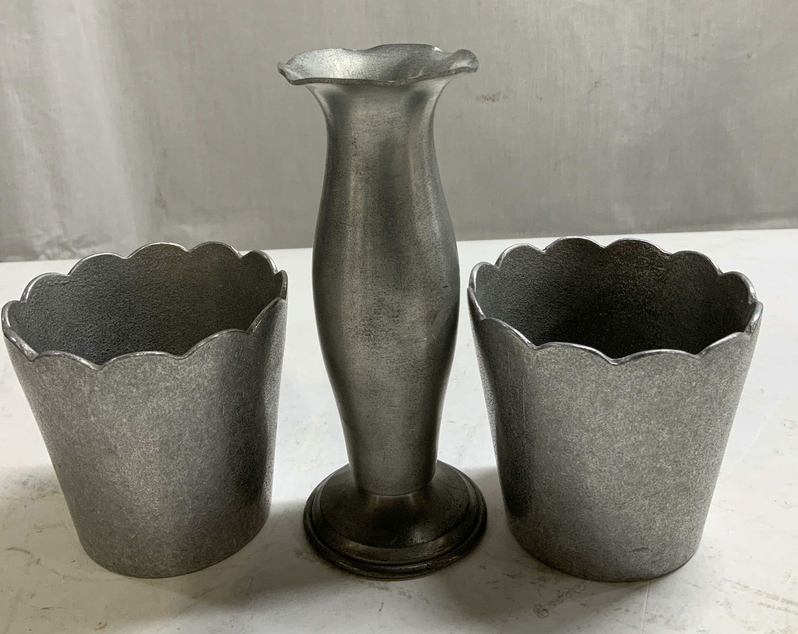 Lot 3 Pewter Candlestick & Pots CONNECTICUT+: Lot includes, 1 Pewter by Connecticut candlestick holder & 2 silver pot XSM greenwhich orchids. Silver toned. Signed & marked on underside. Reads, PEWTER BY CONNECTICUT & SOLVER POT XSM GREENWICH ORCH