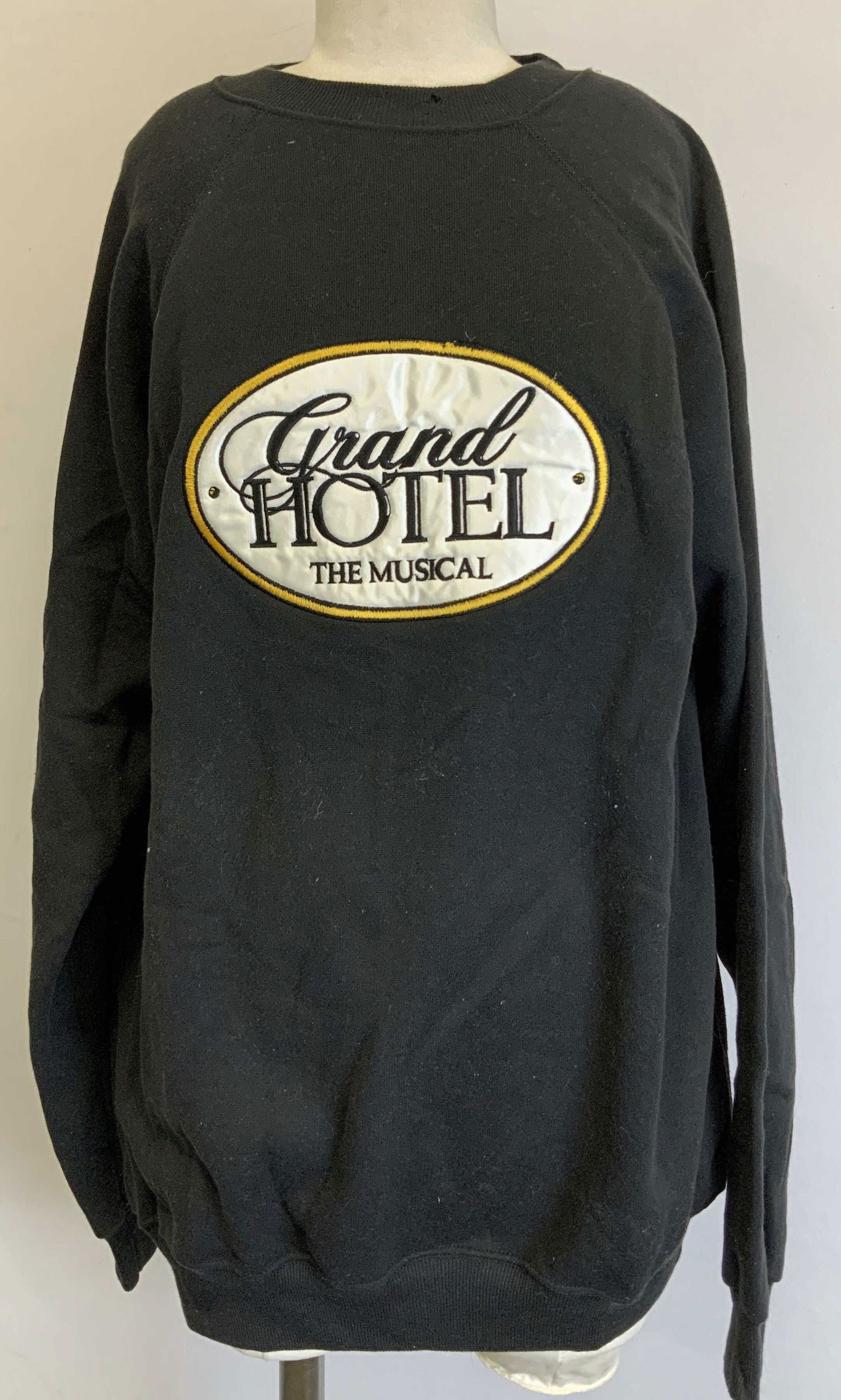 Vtg Hanes Grand Hotel The Musical Sweatshirt USA: Vintage black sweatshirt features an embroidered logo that reads, Grand Hotel The Musical. Yellow border on logo. Size Xl. 50% cotton & 50% acrylic. Made in USA. Property of Upper East Side French sta