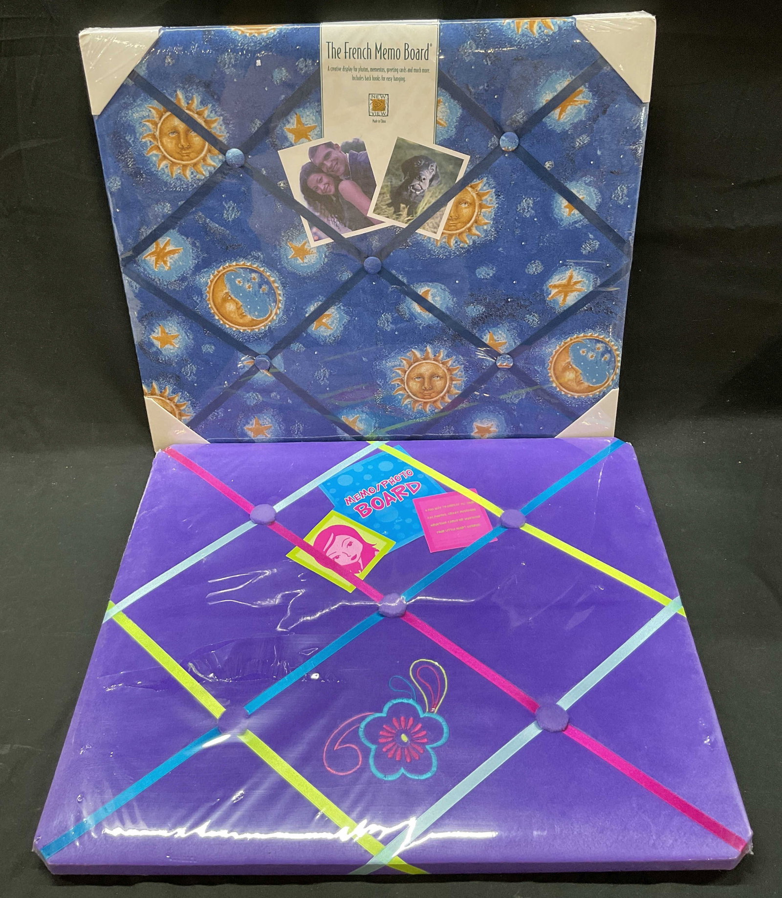Lot 2 New View+ Photo Memo Boards NIP: Lot of 2 items. New View The French Memo Board. Blue celestial pattern with sun, moon, and star motifs. Measures approx 18 x 21 inches. Fuzzy purple photo memo board. Varying colors and floral