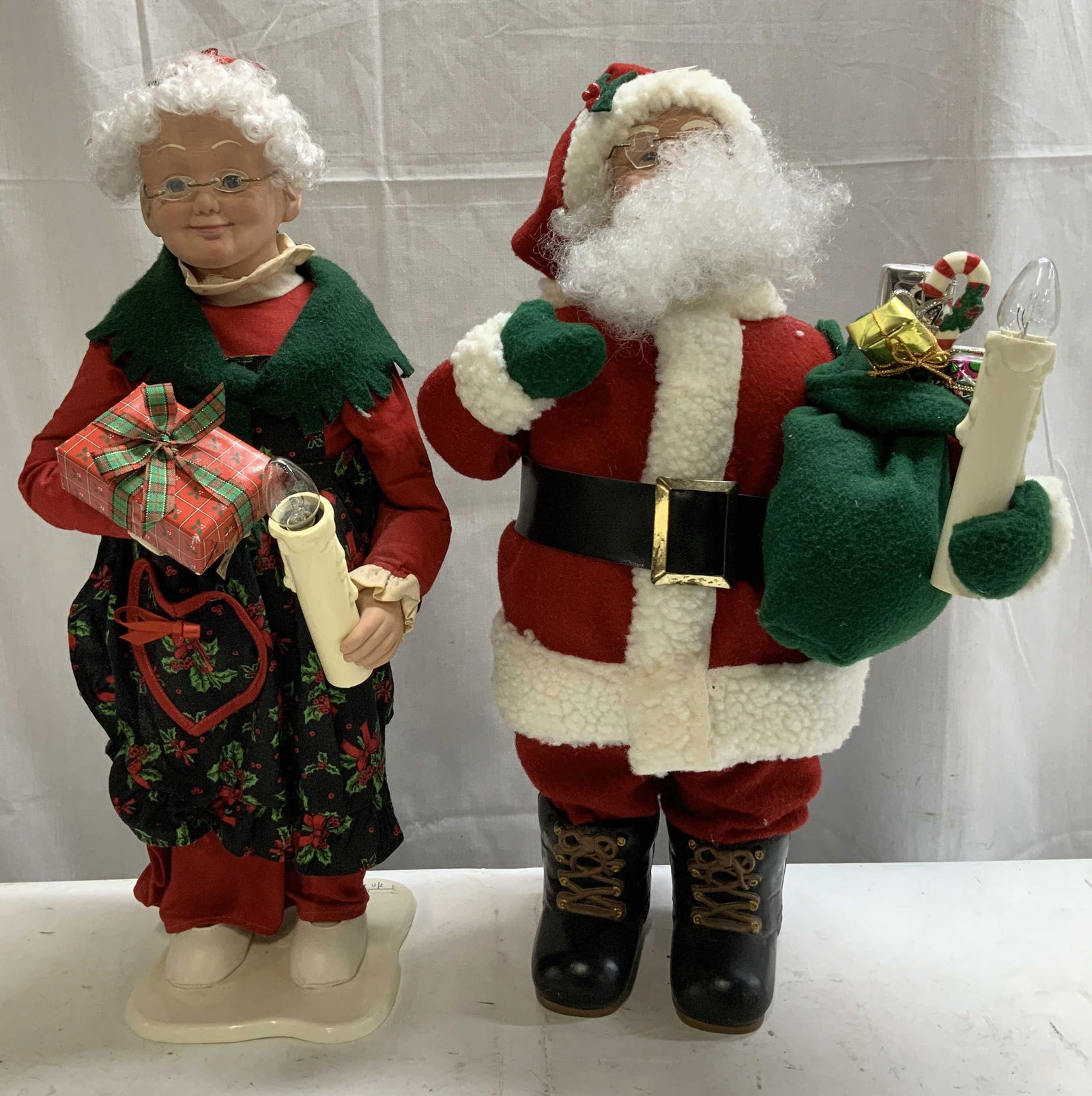 Lot 2 Holiday Creations 1995 Animation Figs: Lot includes, 1995 Ms.Claus animation figurine holding a gift & candle. 1995 Mr.Claus fig holding a bag of gifts. Has not been tested for function, lot is sold as is. Signed & marked. Reads, 1995. HOL