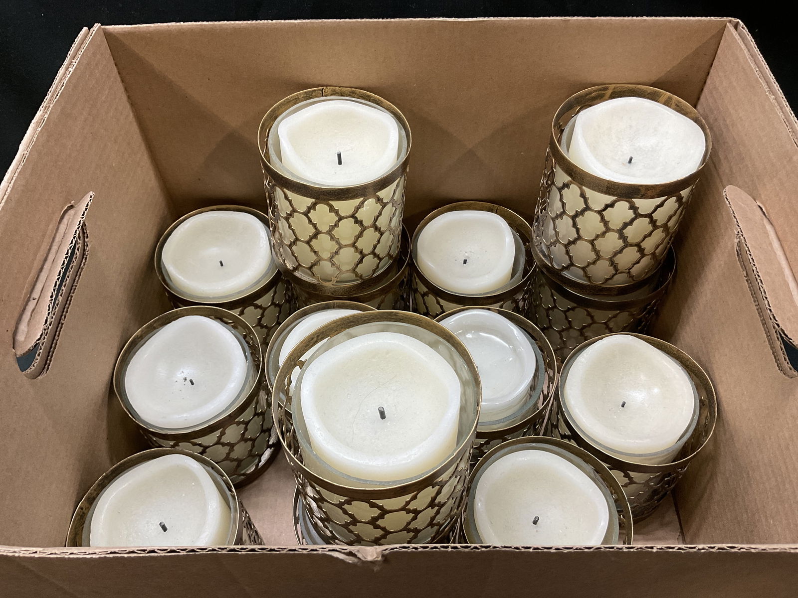 Lot 14 Pier 1 Imports Votive Holder India: Lot of 14 Pier 1 Imports gold toned votive holder. Made in India. Cylinder shape with geometric pattern. Comes with battery operated candles. Comes in cardboard box. Measures ht approx 4 inches diam a