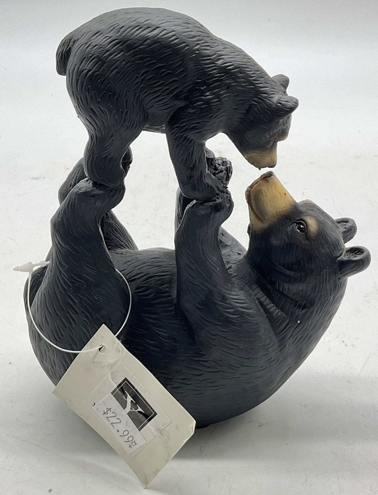 Vintage Resin Bear Collectible Sculpture NWT: New with tag. Vintage resin bear collectible sculpture. Black bear lays on its back while holding up its cub being playful. Detailed features and textures. Tag reads illegibly. Measures approx 2 x 4.5