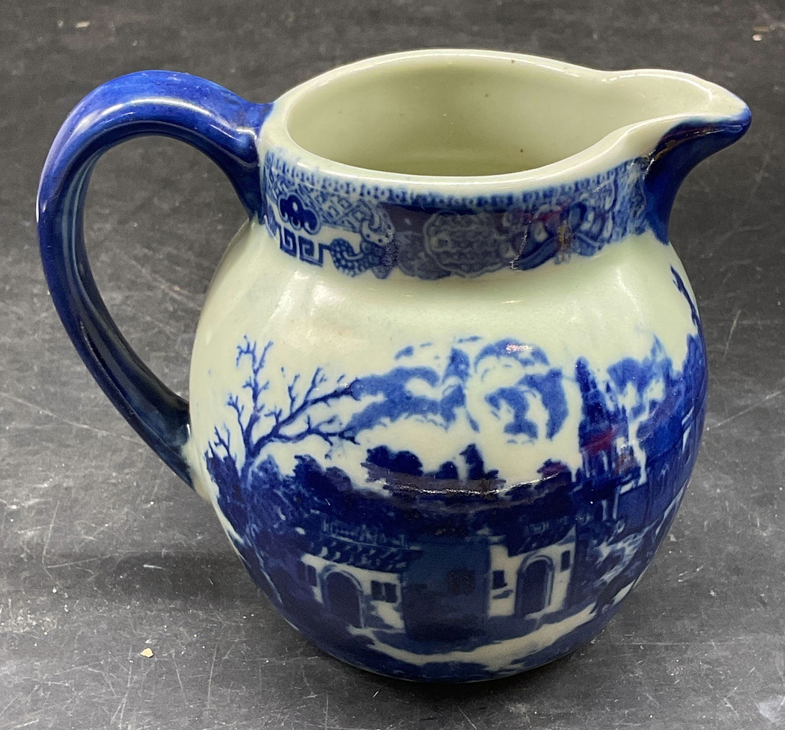 Antq Victoria Ware Ironstone Creamer: Antique Victoria Ware ironstone flow blue creamer. Street scene. Signed. Measures approx. 4.75 x 3.5 x 4 inches. Some scratching. Victoria ware creamer, antique creamer, antiques, collectibles,