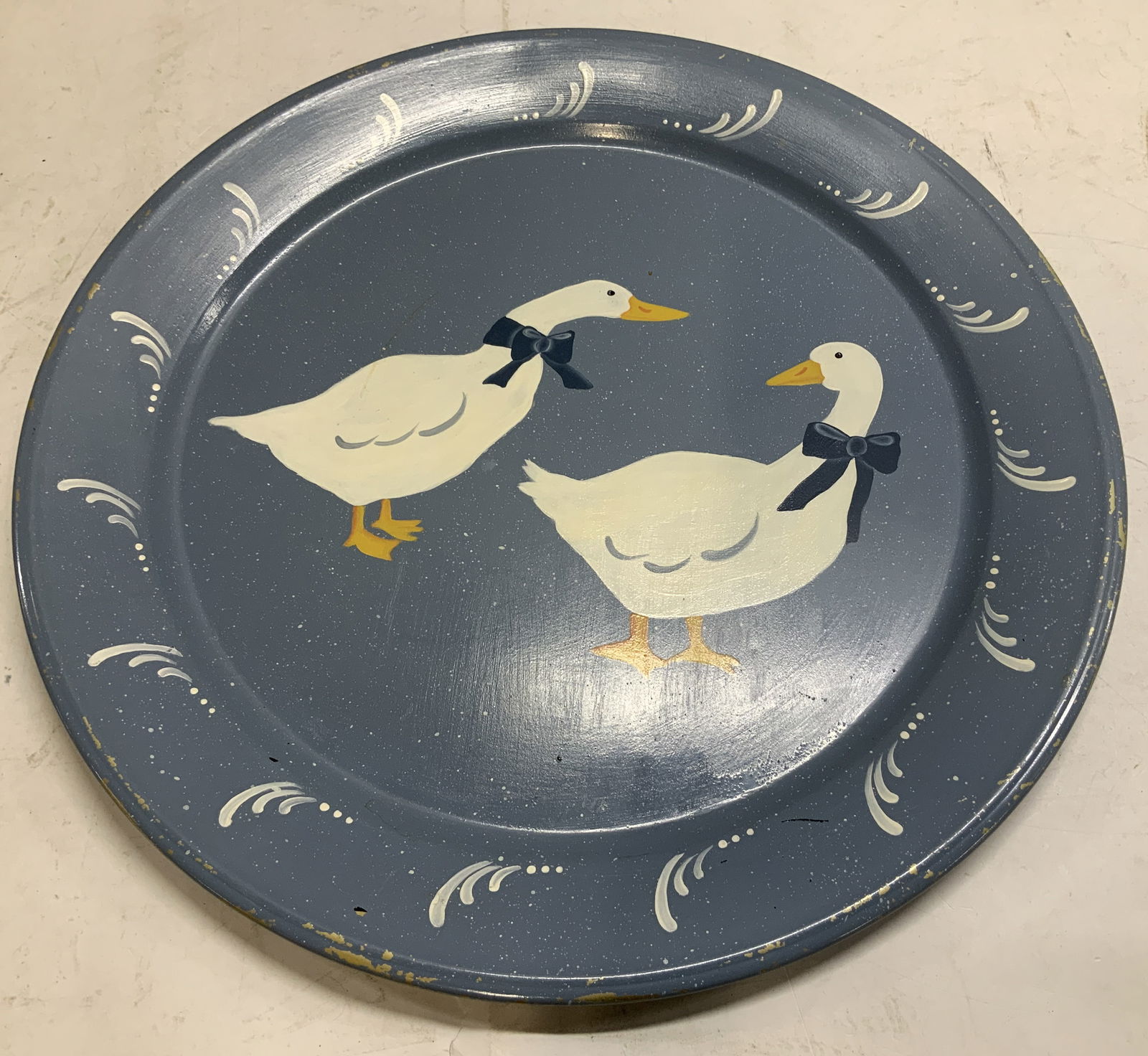 Vtg Hand Painted Ducks Serving Platter: Vintage round serving platter features hand painted white ducks with bows in center. Blue toned. Tin/metal material. Surface wear consistent to age, use & exposure. Measurements: length 19.1in x width