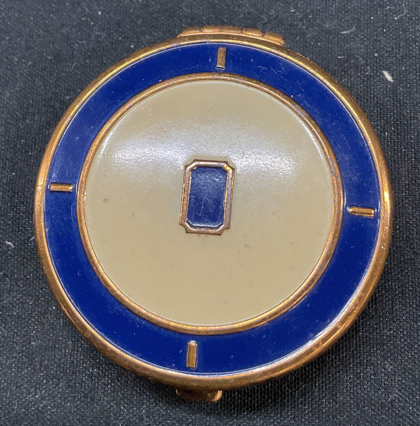 Dorothy Gray Metal Blush Compact: Dorothy Gray metal blush compact. Round gold toned and cobalt blue metal case. Opens to reveal blush and puff. Marked Dorothy Gray. Measures approx 1.5 inches in diameter. Surface wear consistent