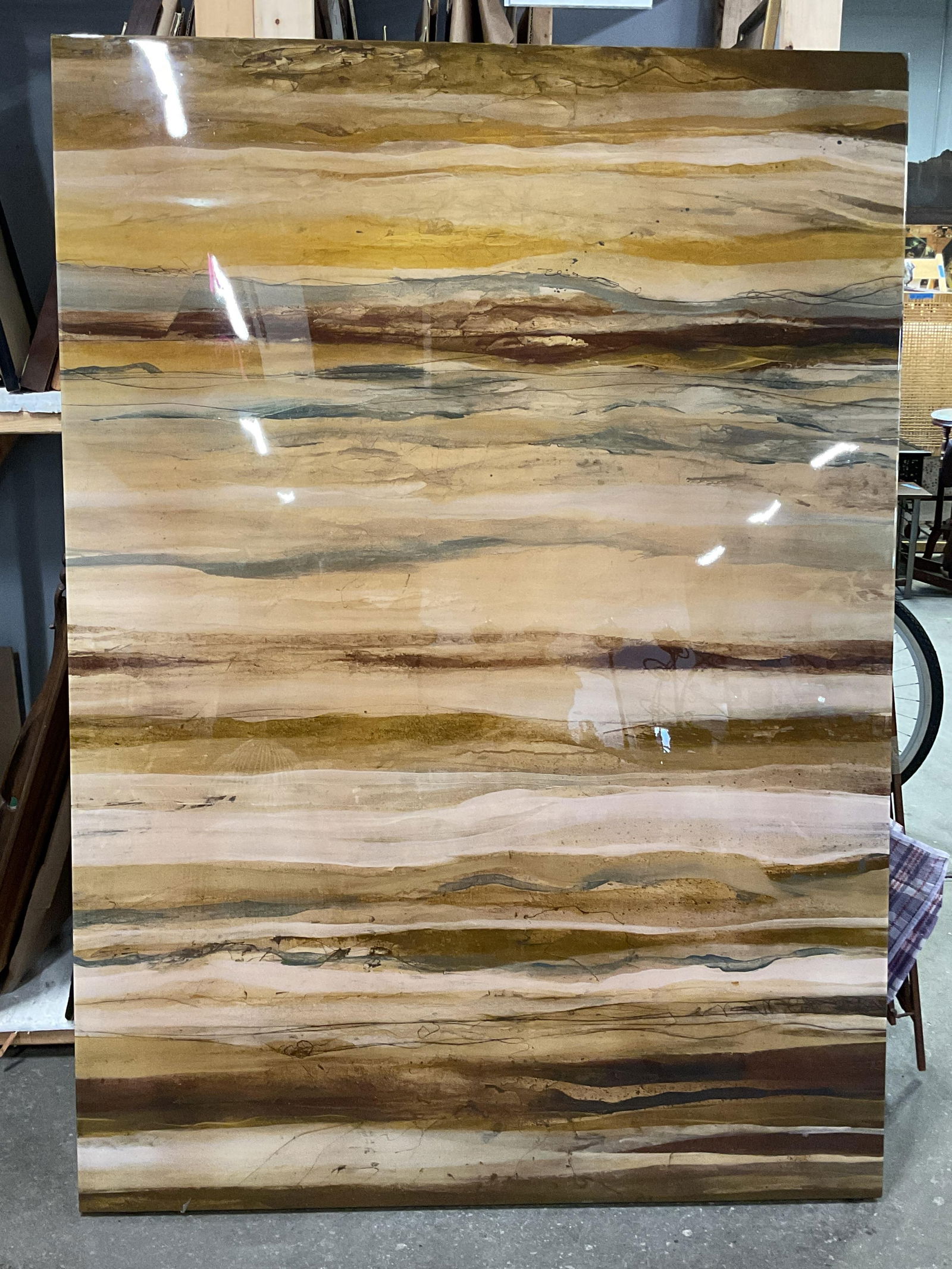 XL Tan Stone Motif Canvas Litho 69x49 In: Canvas lithograph print mounted on wood board. Tan stone motif detail. Measures approx. 69.75 x 49.75 inches. Wear including scratching. Art, framed art, home decor, home accessories, wall decor,