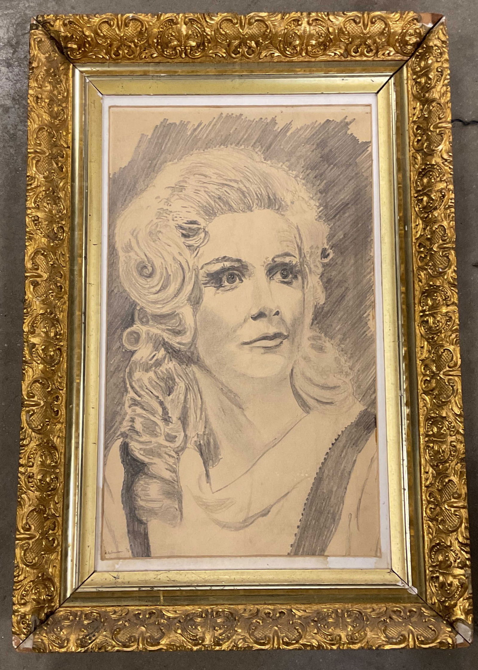 Framed Signed Portrait of a Woman Drawing 25in: Framed drawing on paper. Portrait of a woman. Signed lower left, illegible, 1976. Ornate gilt wood frame. Not examined out of frame. Frame measures approx. 25 x 17 inches. Wear including losses to fra