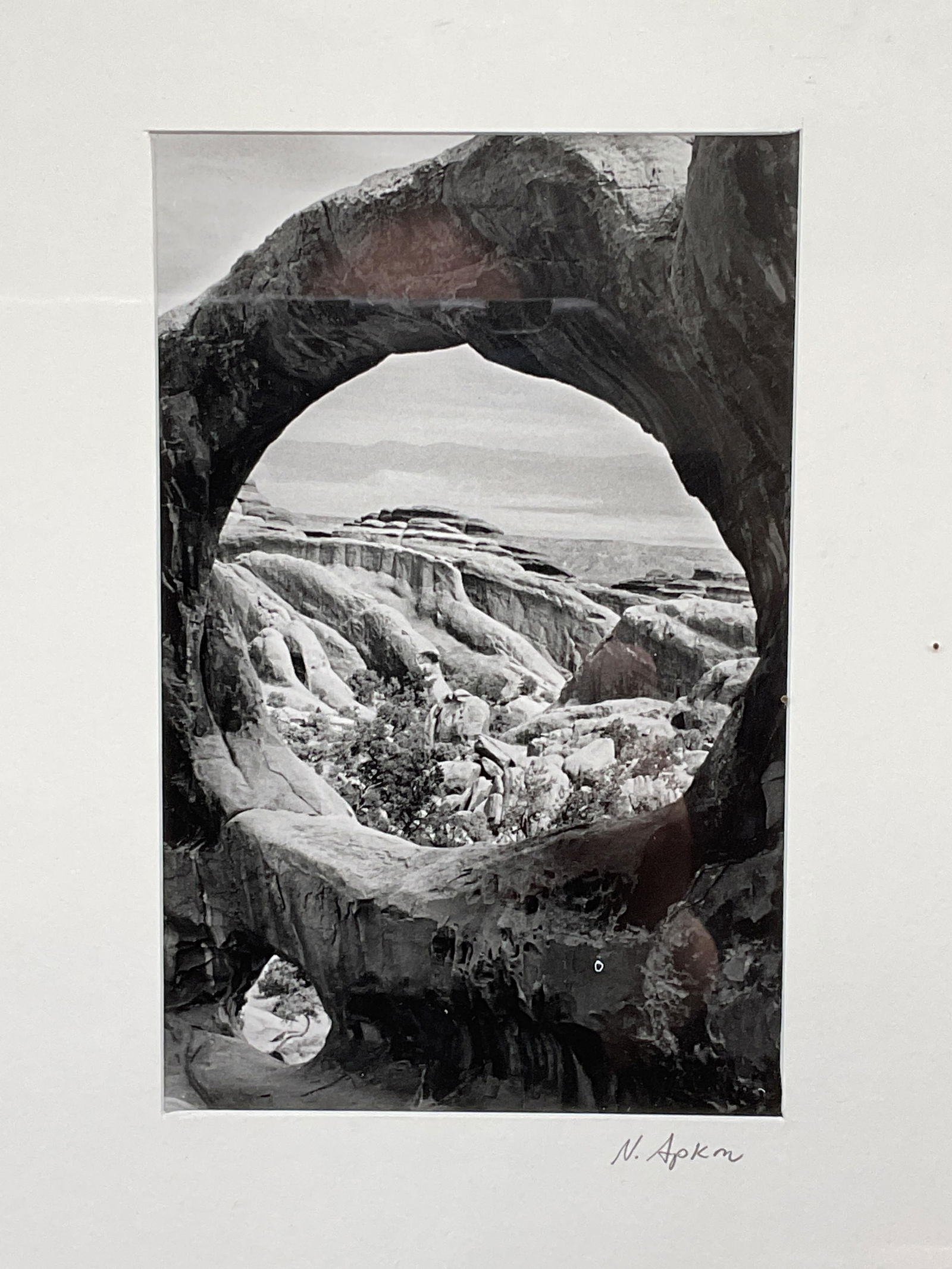 Signed N Apkon Nature Rock Formation Print: Framed and matted black and white fine art print. Signed on the mat, N Apkon. Nature scenery, rock formation. Silver tone metal frame. Not examined out of frame. Frame measures approx. 14.25 x 11.25 i