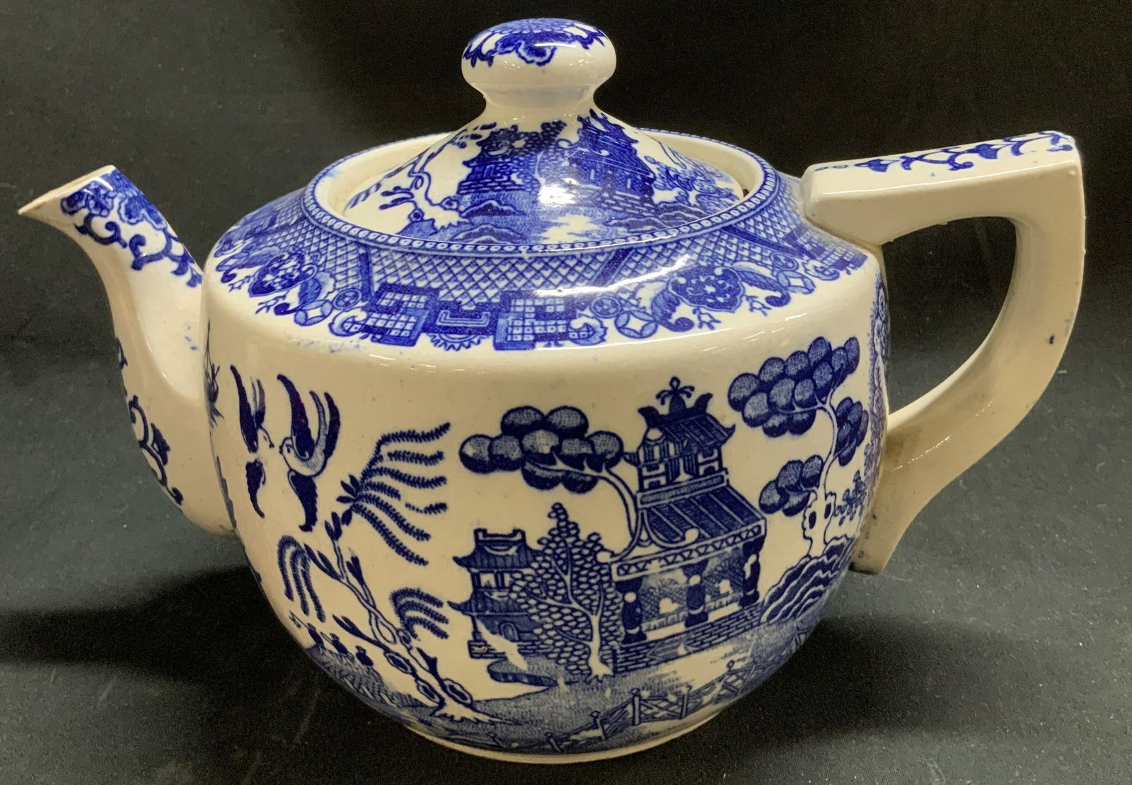 Vtg House of Blue Willow Ceramic Teapot JAPAN: Vintage House of Blue Willow ceramic teapot, featuring a scene of trees, birds, pagoda style houses & more. Blue & white toned. Signed & marked on underside. Reads, ESTABLISHED HOUSE OF BLUE WILLOW. M