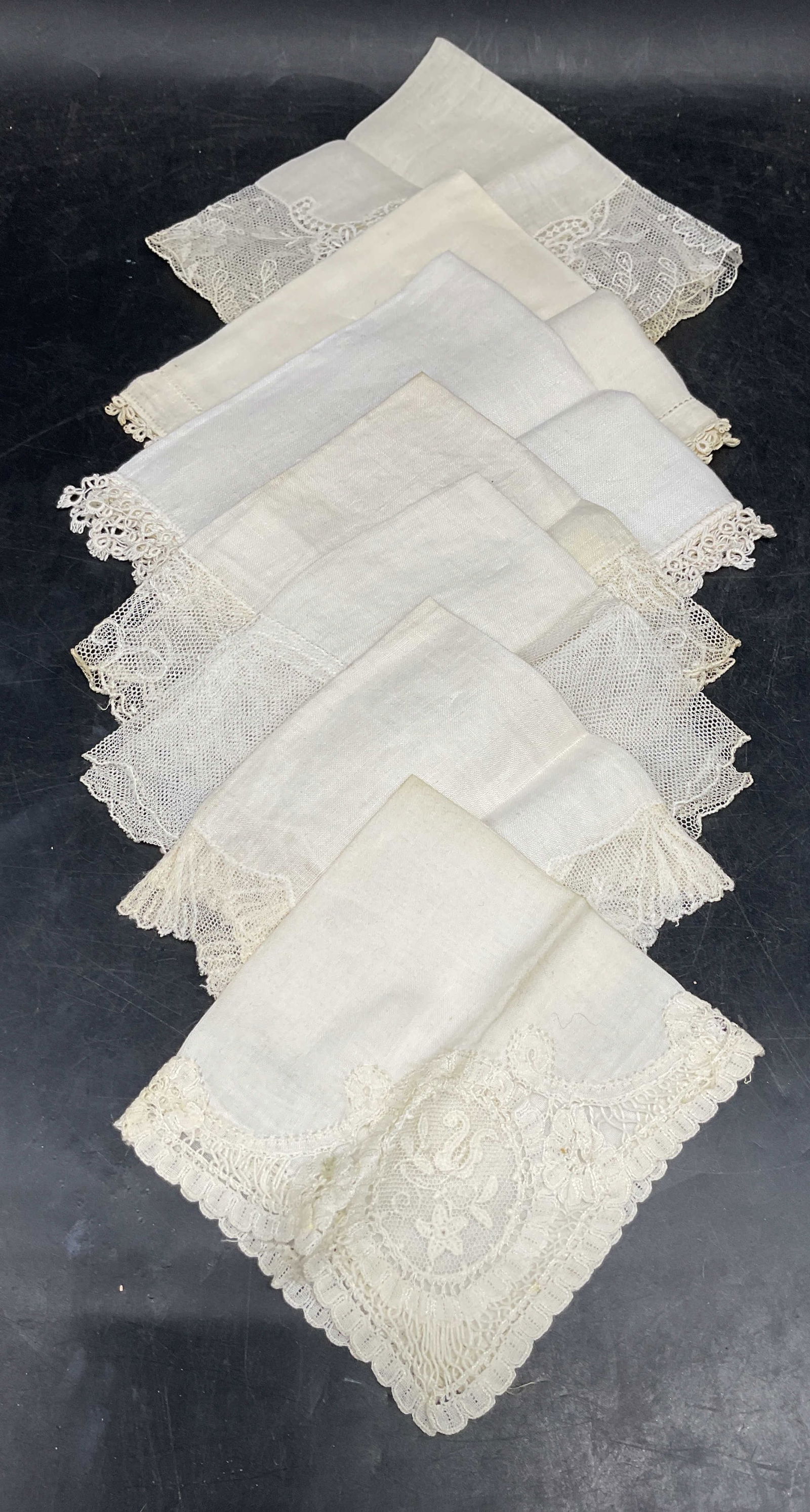 Lot 7 Vtg White Lace Cotton Handkerchiefs: Lot of 7 vintage white cotton handkerchief with lace edges. Largest measures approx. 12 x 12 inches. Some blemishes and small tears. Handkerchief, Vintage handkerchief, collectible handkerchief, acces