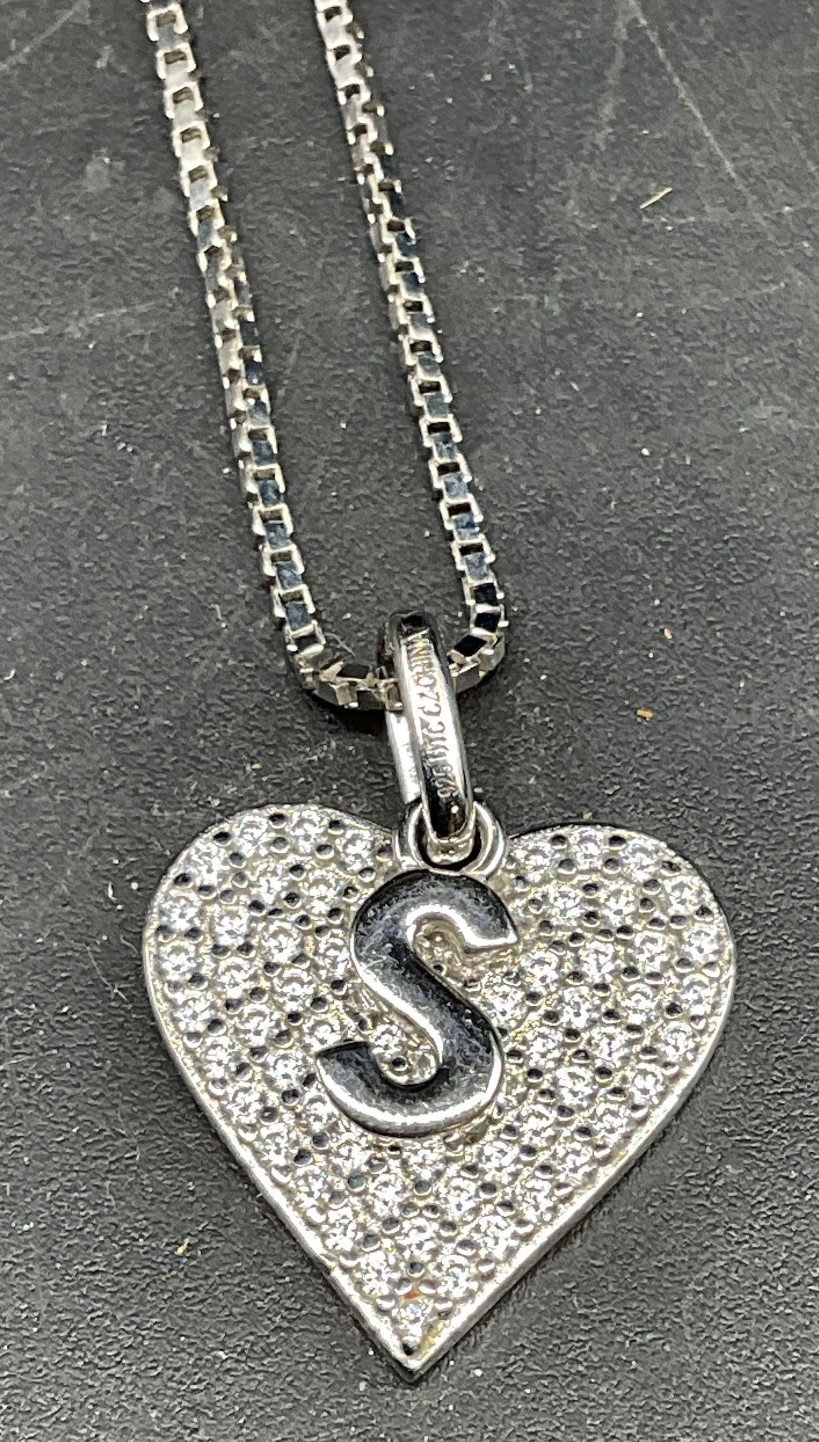 Sterling Silver S Heart CZ Pendant Necklace: Sterling silver necklace with s and heart motif cubic zirconia pendant. Drop length approx 9 inches. Marked sterling. Total weight 6.2 grams. Some scratching. Jewelry, estate jewelry, fine